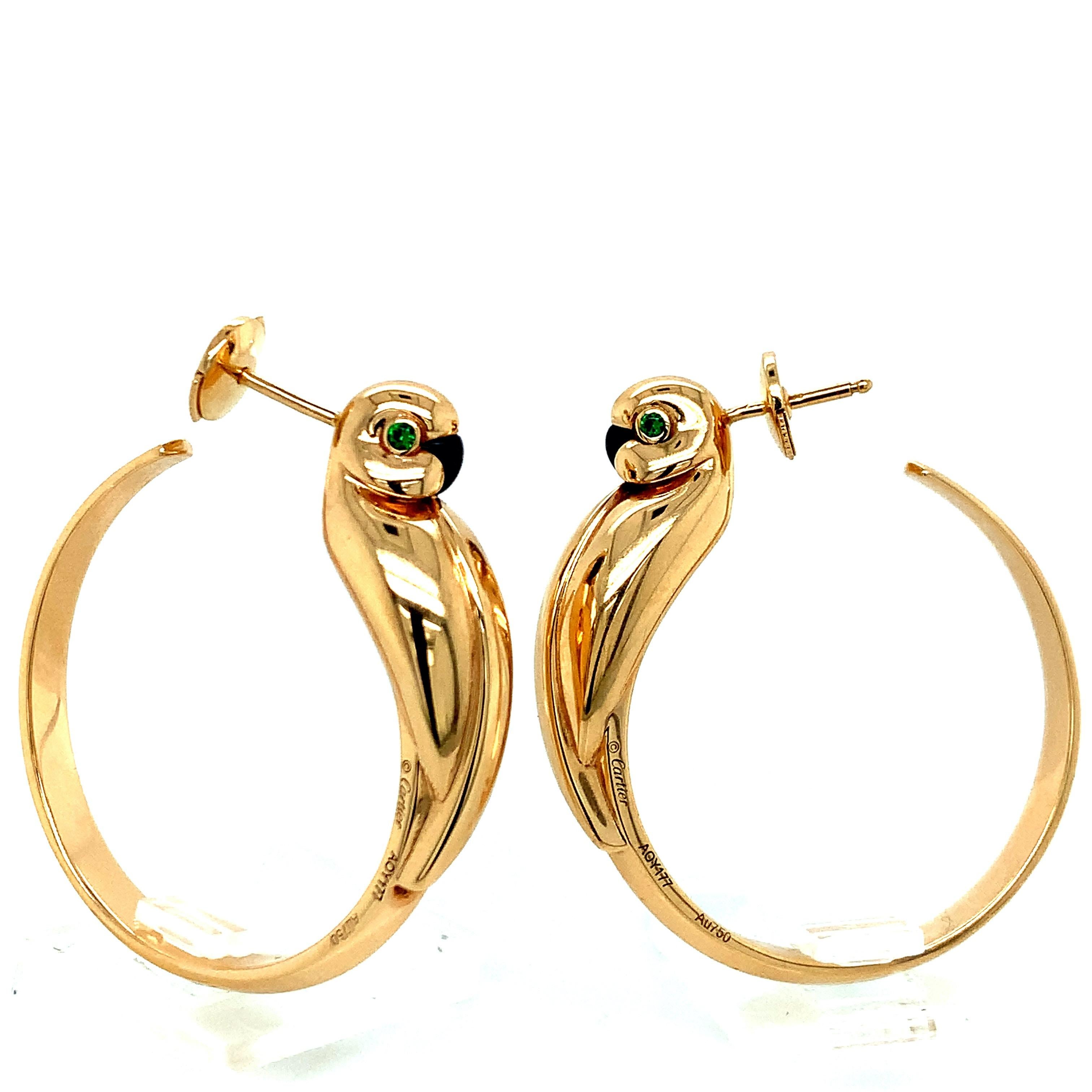 Cartier 18K Gold Parrot Hoop Earrings

Hoops made of 18 karat yellow gold, with parrot birds motif and emerald stones for the eyes; marked Cartier / Au750 / PA 750 Mecan / 18K. Serial No. AOY177.

Size: width 1.25 inches, length 1.38 inches
Total