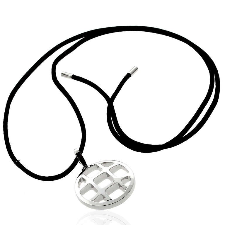 An iconic authentic Cartier Pasha necklace crafted in 18k white gold suspended by an adjustable 24