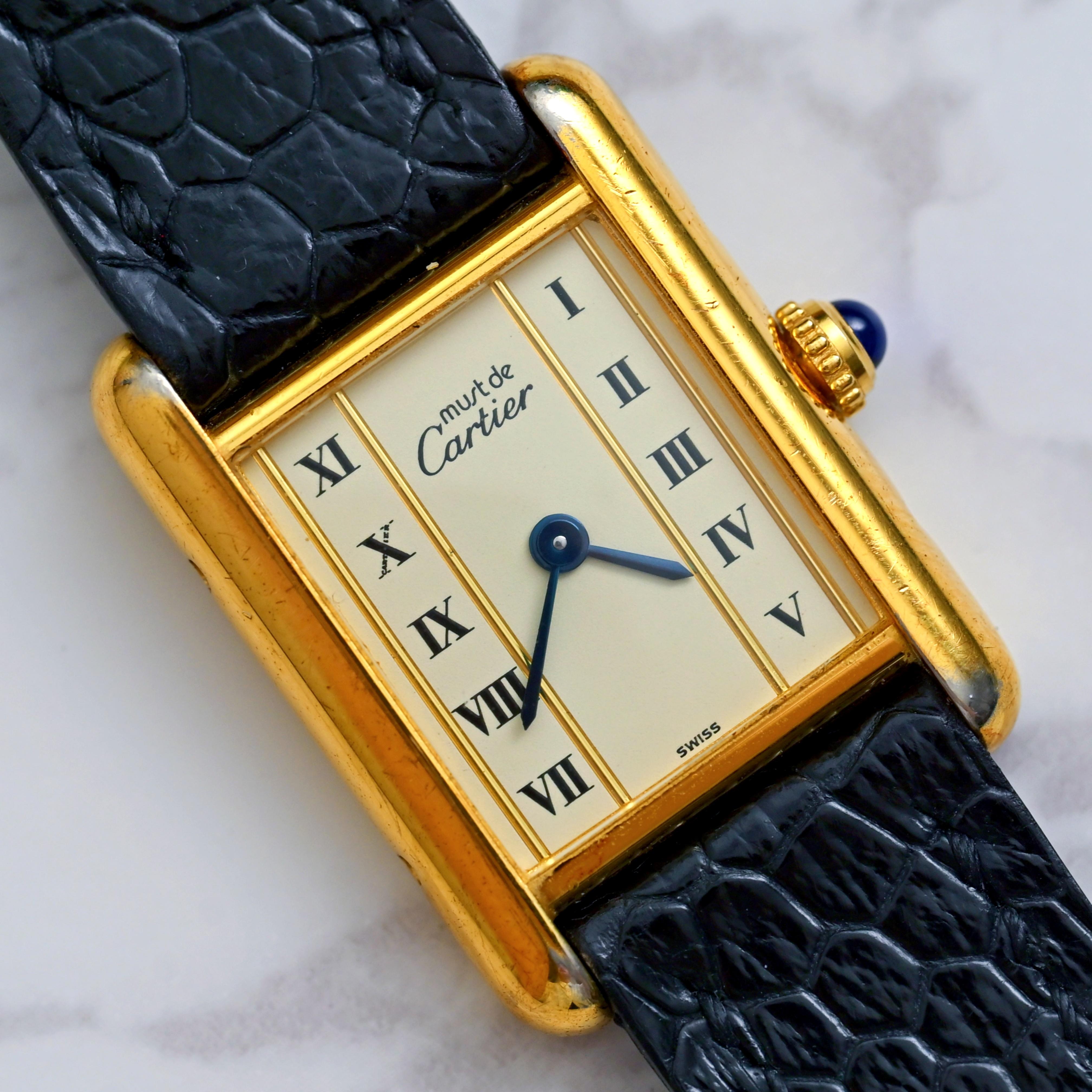 Brand: Cartier
Model: Must de Tank Vermeil 5057001
Year: 1980’s
Serial Number: 14xxxx

Reference: C04516

Case: Shows signs of wear with 950 Silver w/Gold Plated case in size 20mm x 28mm without crown; model & serial number is engraved on the case