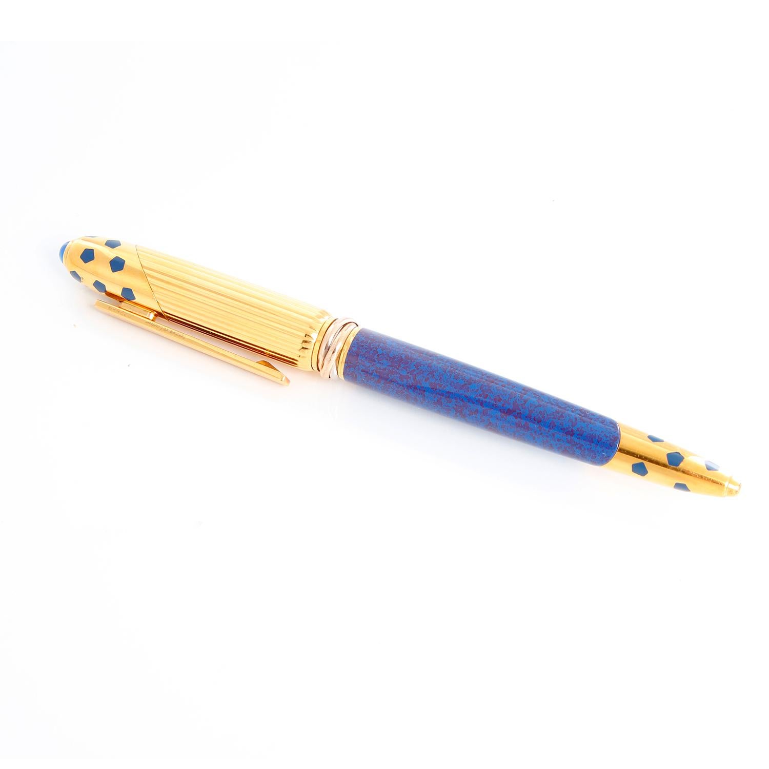 Cartier Gold Plated Panthere Pen - Must de Cartier rollerball pen in blue with gold plated accents. Center with a Cartier trinity ring and a paperclip. Length 5.25