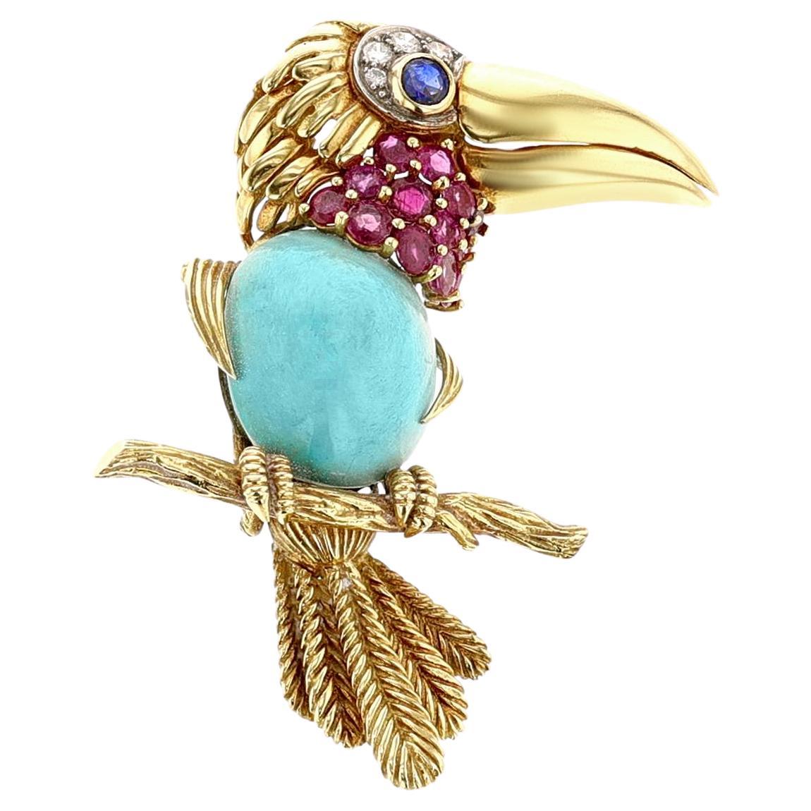 Broche Toucan en or, platine, turquoise, rubis, saphir et diamants de Cartier en vente