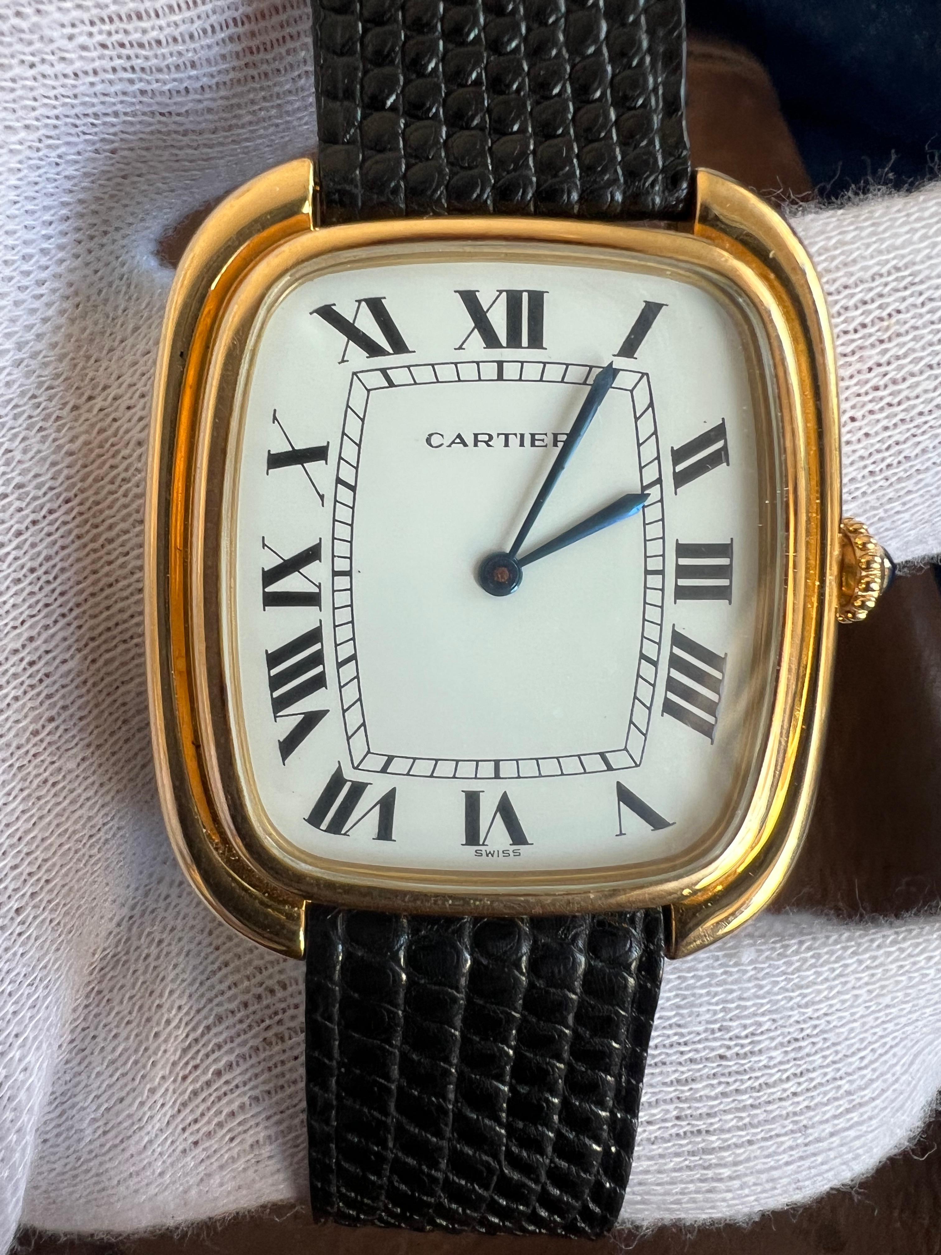 A rare watch presented here-a full set of a 1979's Cartier Gondole watch in jumbo vertical size (34x39mm). Manual wind movement, classic cabochon crown, blued dagger hands. Watch is crafted in 18k solid gold. Beautiful lightly used condition,