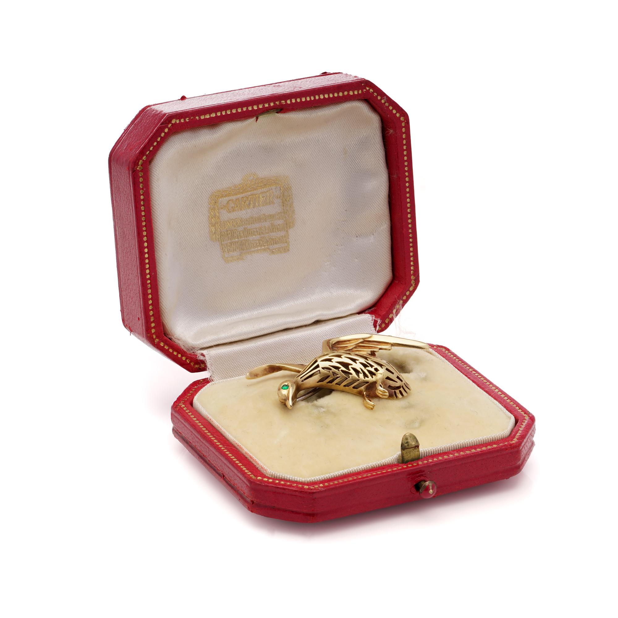Cartier Goose Bird Brooch in 18kt Yellow Gold with Emerald Eye. 

This charming Cartier goose bird brooch, made in 1957, is a delightful addition to any collection. Fashioned in 18kt yellow gold, it features a meticulously crafted goose with an