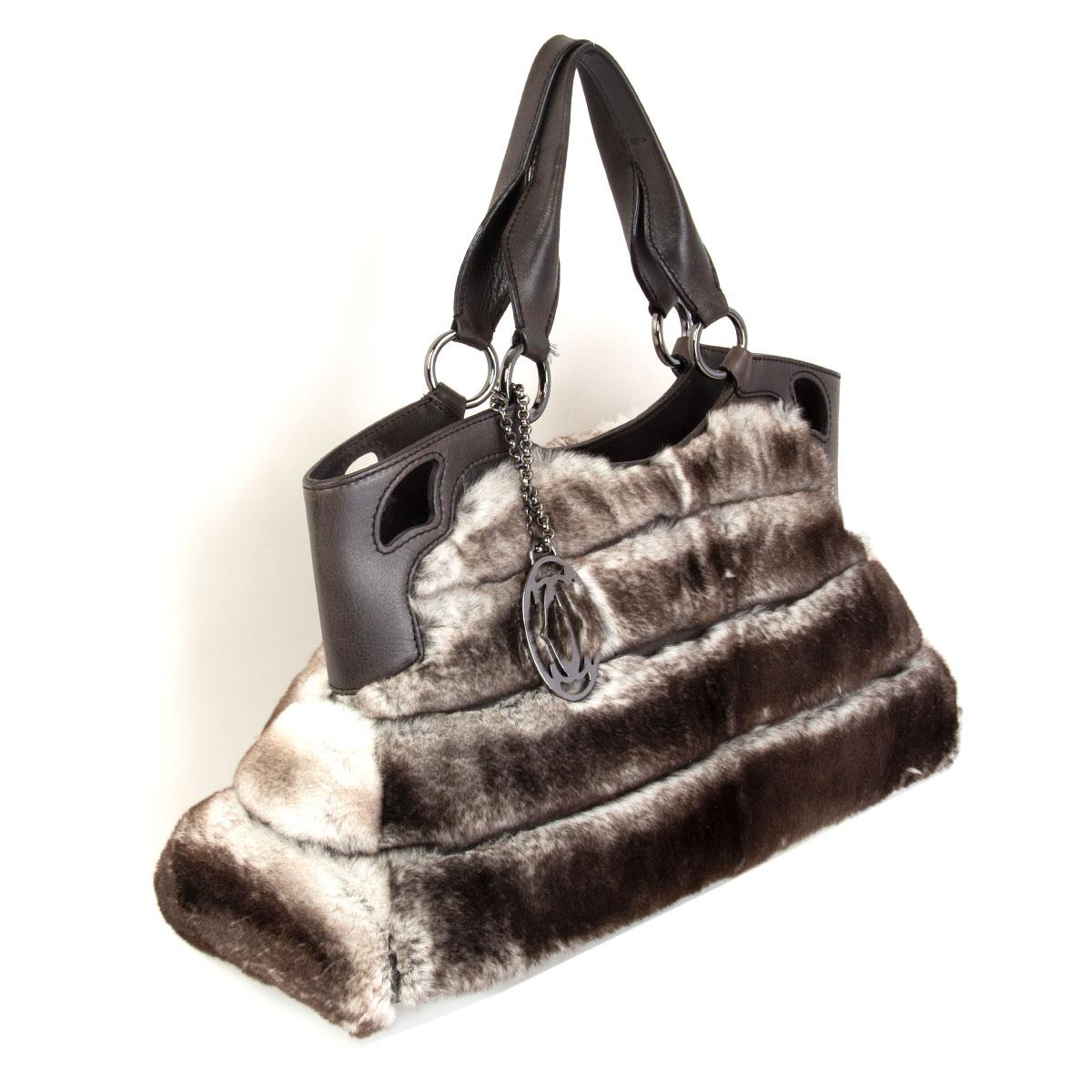 Cartier 'Marcello de Cartier' medium handbag in grey, taupe and off-white rabbit fur and brown-grey calfskin handles and trim. Opens with a zipper on top and is lined in beige canvas with one open pocket against the    back and a small open pocket