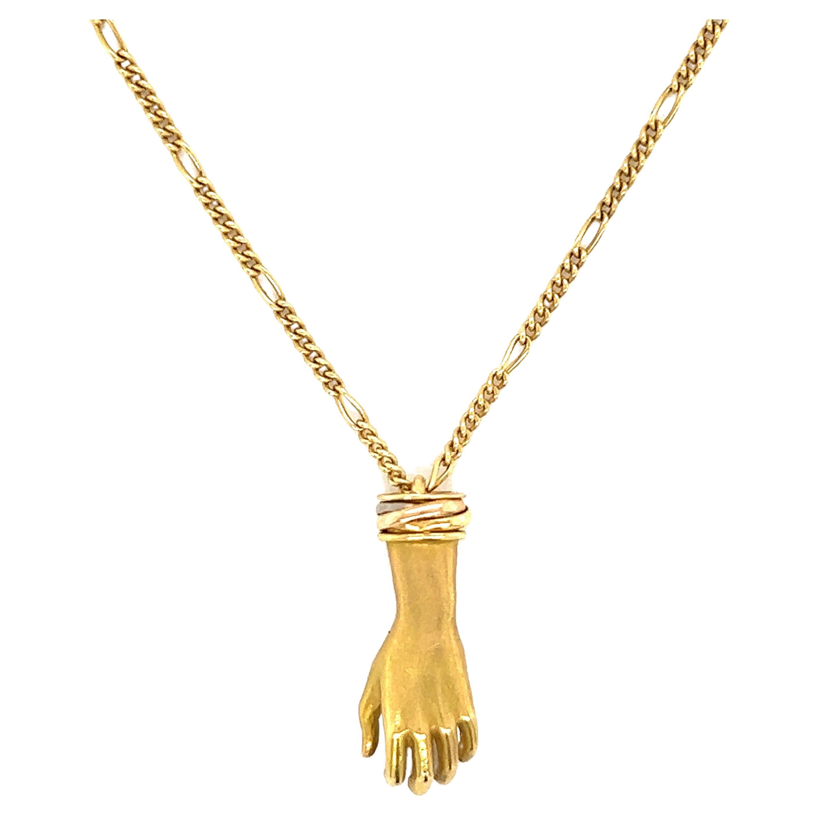 Cartier, collier à pendentif à la main en or