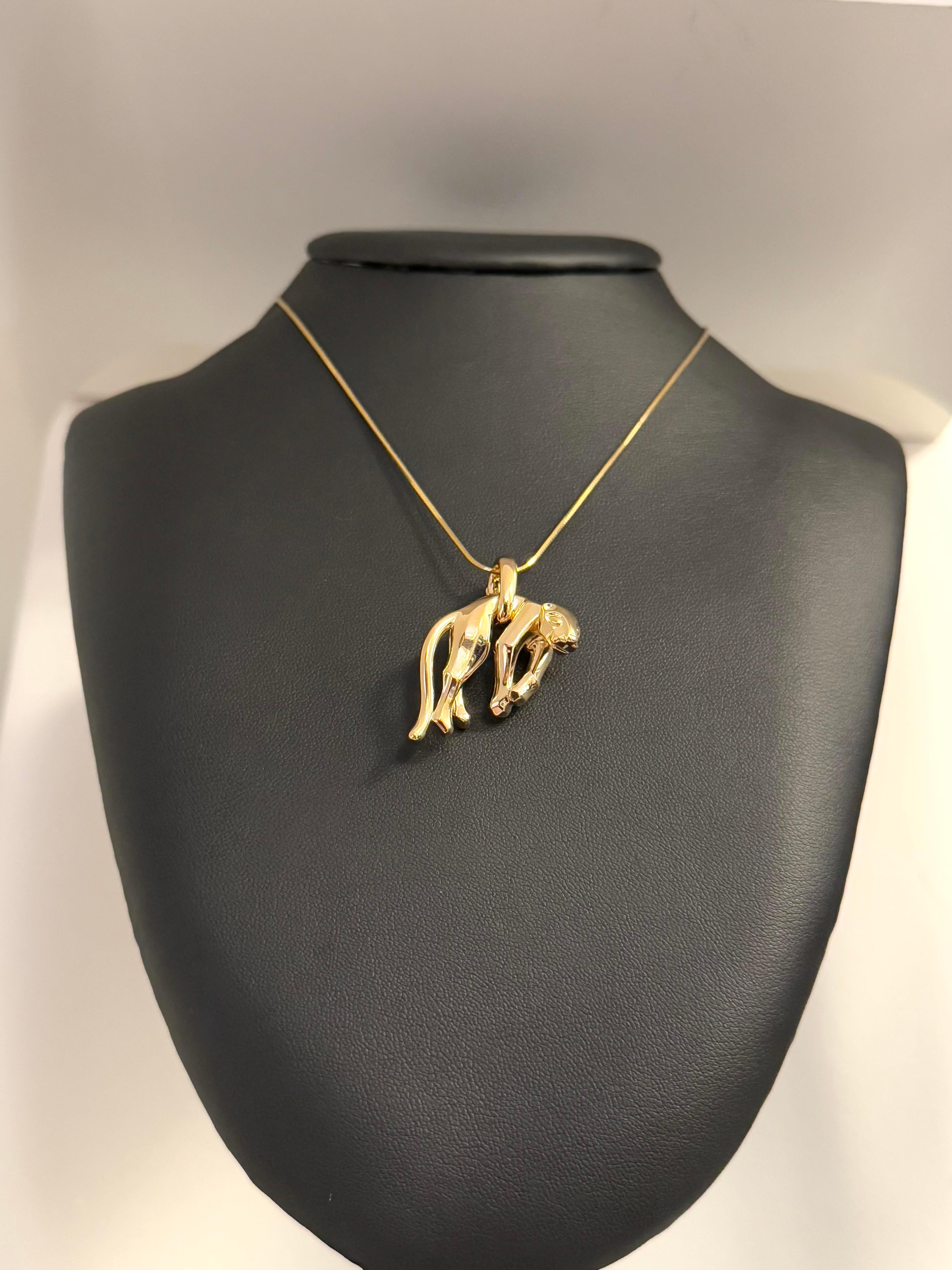The Cartier Hanging Panther Pendant is a striking and rare creation from 1991, embodying the fierce elegance and exceptional craftsmanship that define Cartier’s Panthère collection. Crafted from 18-karat yellow gold, this exquisite piece features