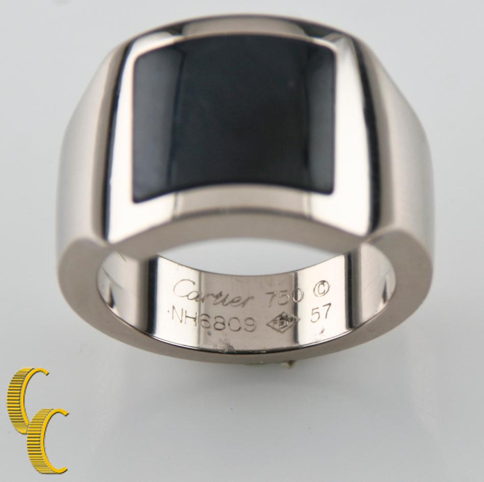 Gorgeous, Modern Santos Dumont Ring by Cartier
Features Flush Set Custom-Cut Hawk's Eye Cabochon
Dimensions of Cabochon = 12.5 mm x 11.5 mm
Width of Band = 6 mm
Width of Stone Setting = 15 mm
Ring Size 8 (57 French Size)
Interior Hallmarked 
