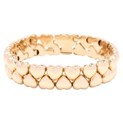 Bracelet Cartier, or jaune 18 carats, longueur 7 pouces, multi-cœurs, designer