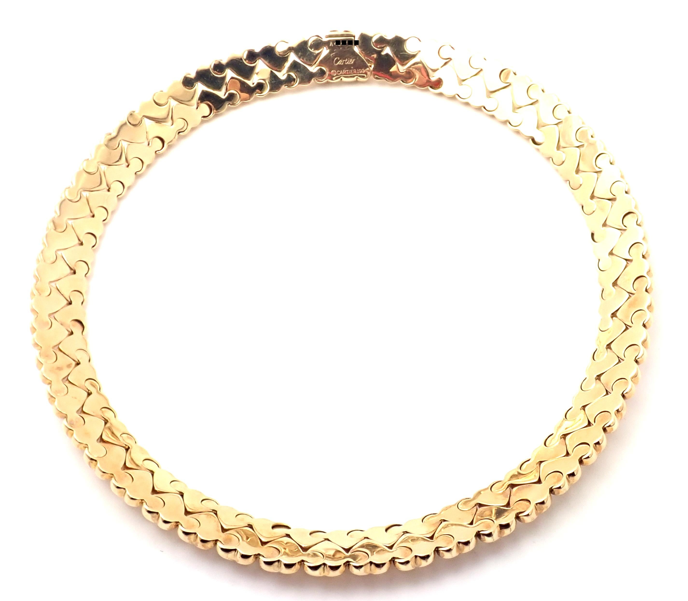 18k Yellow Gold Heart Choker Necklace by Cartier. 
Details: 
Weight: 87.5 grams
Length: 16