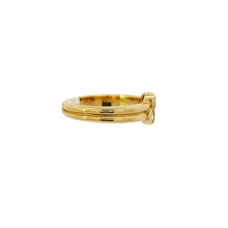 This elegant Cartier ring is crafted from 18k gold and features round brilliant cut diamonds totaling approximately 0.10 carats. Weighing 3.69 grams and sized at 5, it offers a refined sparkle and timeless sophistication, making it a perfect