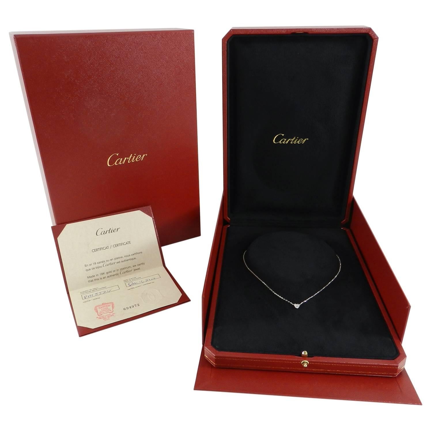 Cartier Heart of Cartier Mini 18k White Gold Diamond Heart Necklace.  Necklace fastens at 15” and 16”.  Heart pendant is set with 3 white diamonds and measures about 5mm wide x 6mm tall.  Excellent pre-owned condition - as new.  Includes large