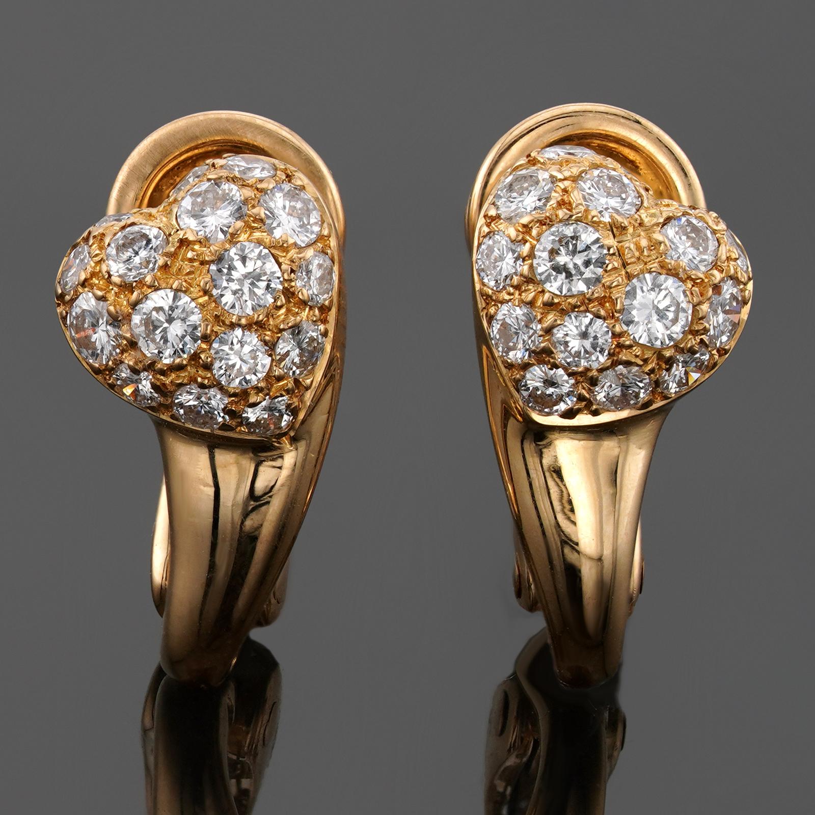 These gorgeous Cartier earrings feature a heart-shaped design crafted in 18k yellow gold and pave-set with round brilliant D-E-F VVS1-VVS2 diamonds. Made in France circa 1990s. Measurements: 0.27