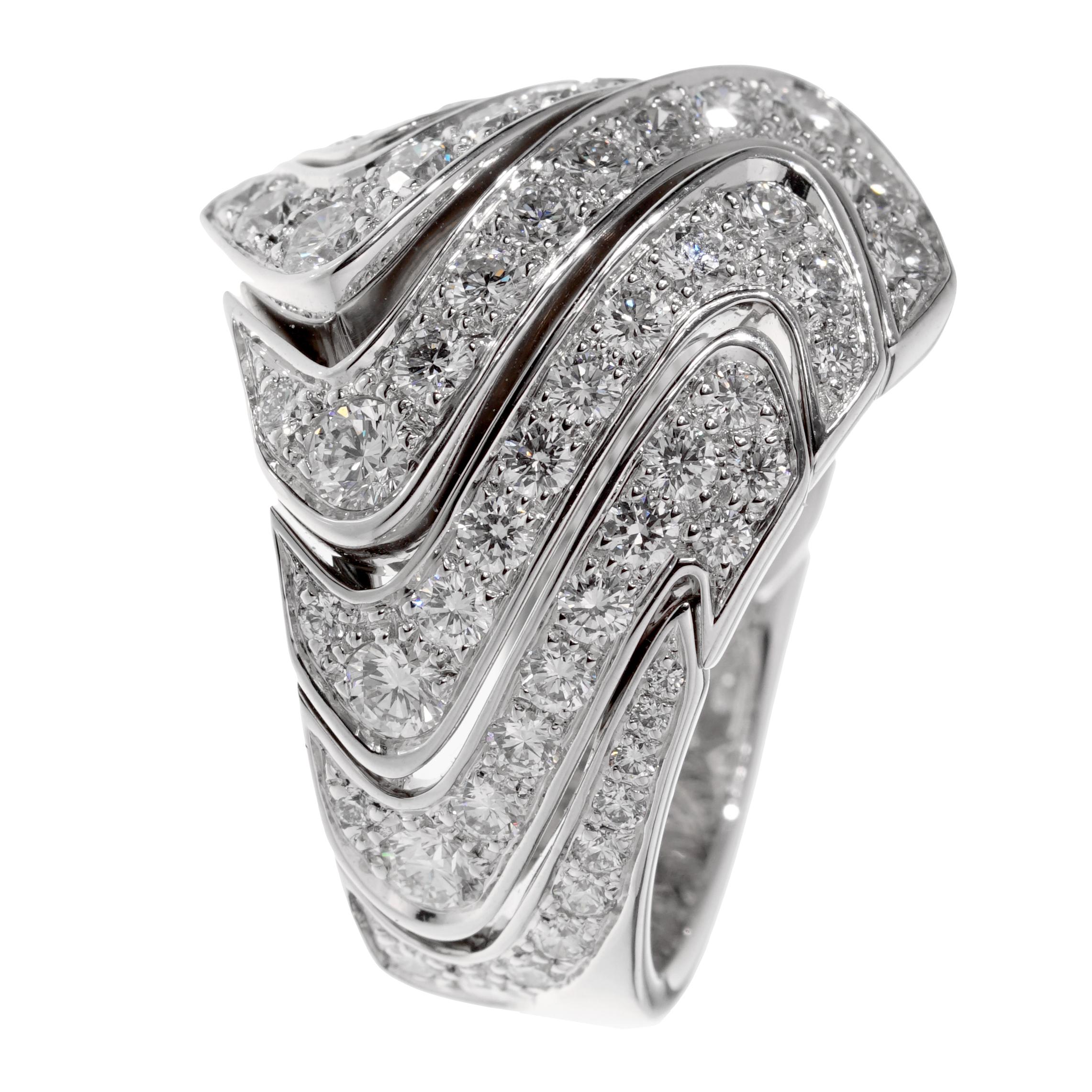 A magnificent cocktail ring by Cartier showcasing a plethora of the finest Cartier round brilliant cut diamonds set in shimmering 18k white gold. The ring measures almost 1