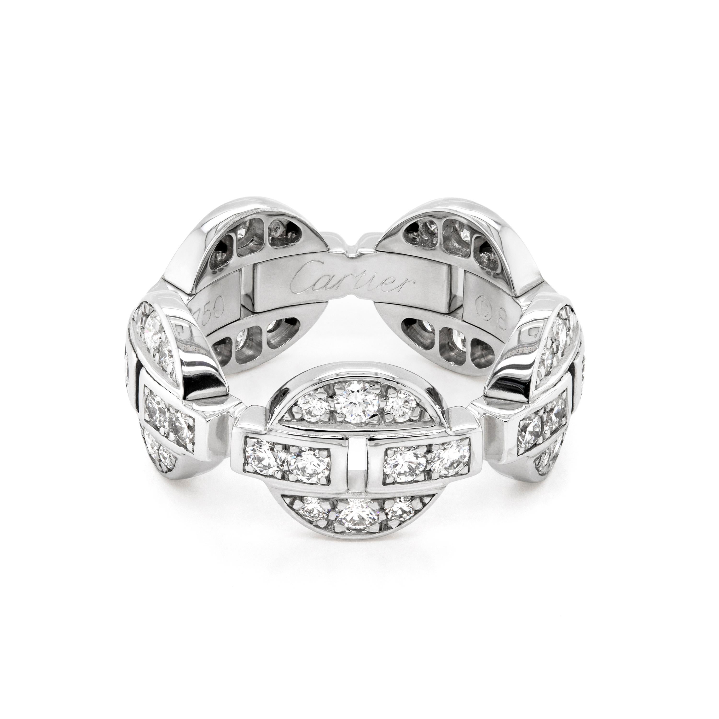 This beautiful ring is from Cartier's Himalia collection. The ring is crafted in 18 carat white gold, featuring five circular motifs all perfectly inlaid with fine quality diamonds, linked together to create this unique piece of jewellery, The ring