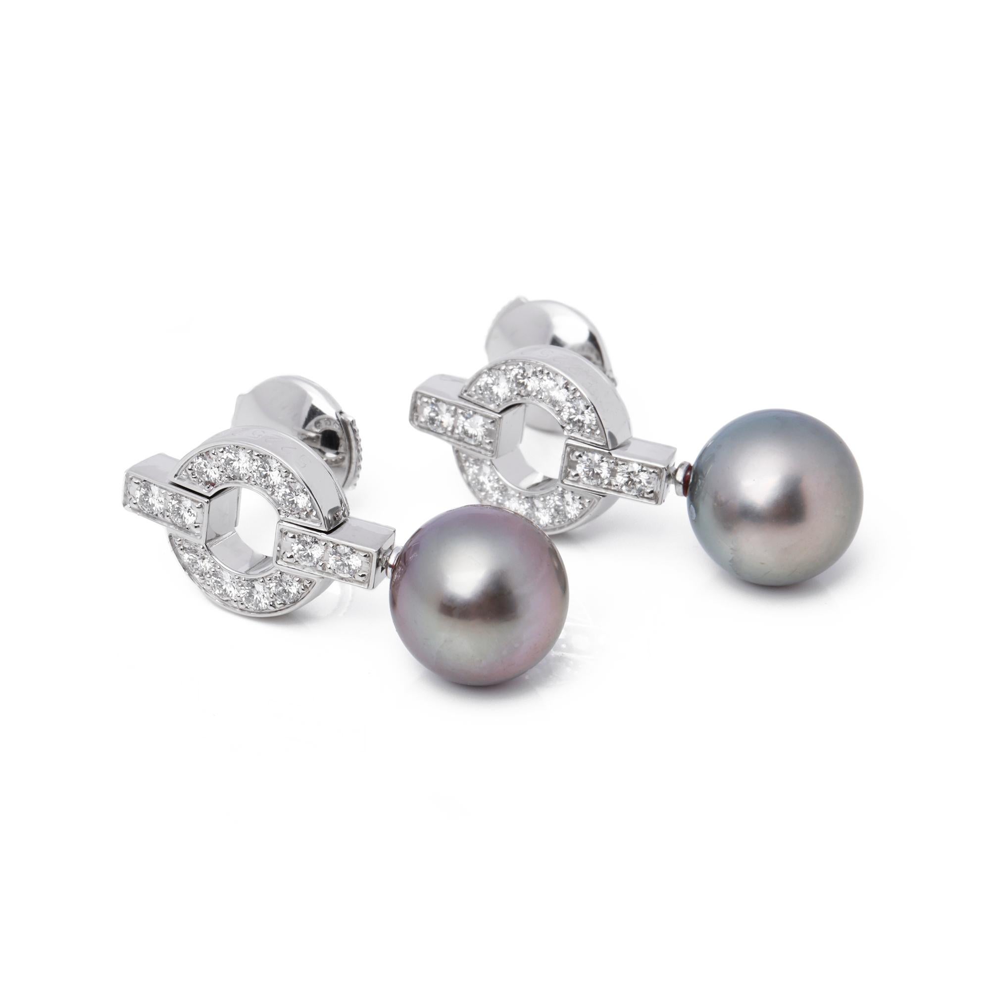These earrings from Cartier's Himalia collection feature 24 round brilliant cut diamonds, totalling 0.42ct made in 18ct white gold. They also feature a single round Tahitian pearl each, measuring 9.5mm. Accompanied with it's original Cartier box and