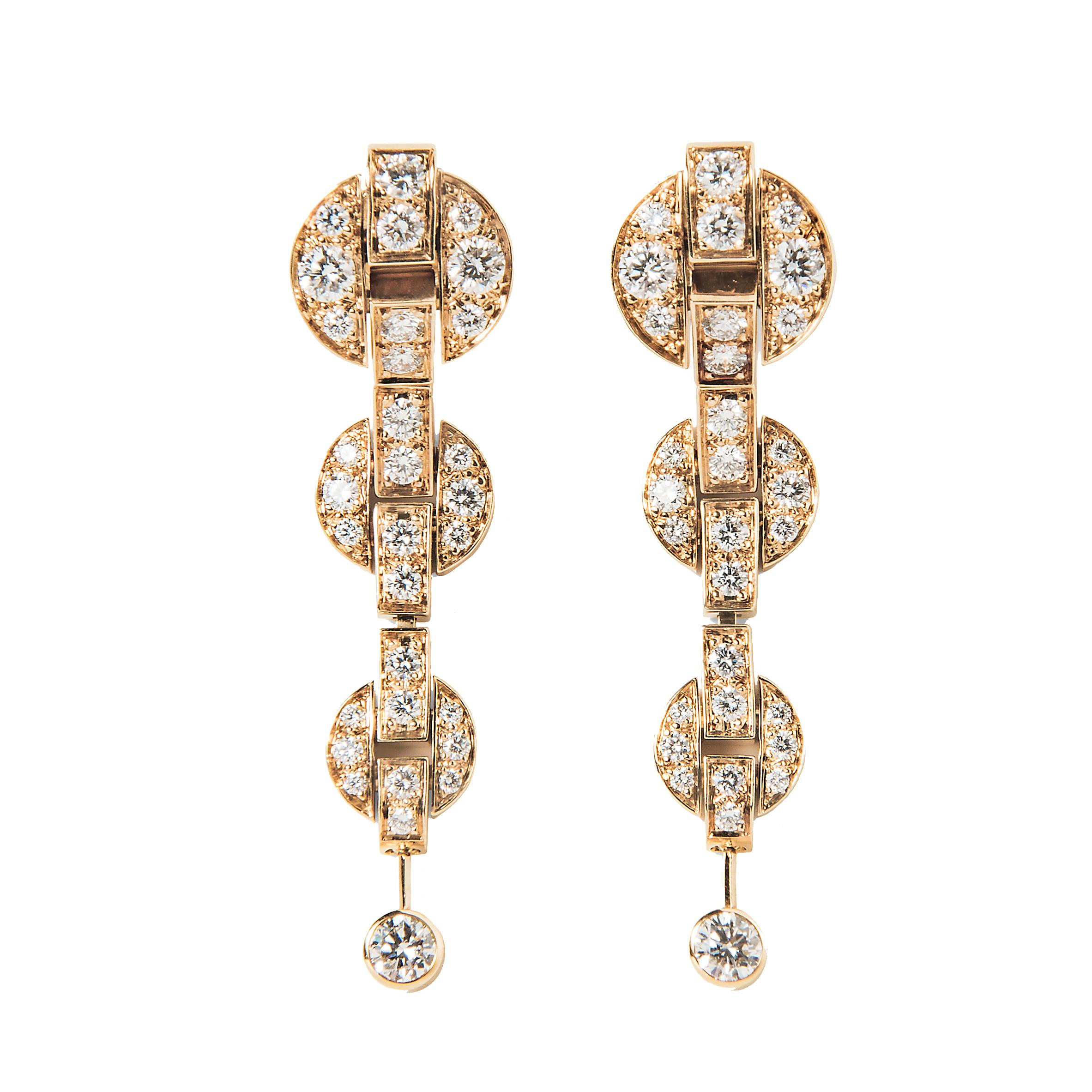 Instantly recognizable as Cartier, these Himalia earrings feature an effortlessly modern circular design throughout. Individual 18k yellow gold circlets are set with the finest Cartier round brilliant cut diamonds, linked together to form these