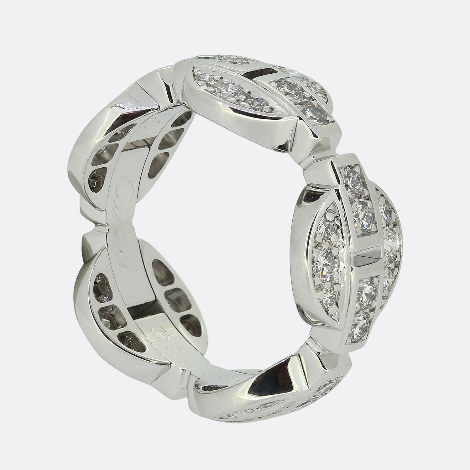 Here we have a beautiful diamond ring from the world renowned luxury jewellery house of Cartier. This particular piece forms part of their Himalia collection and features five circular motifs all perfectly inlaid with fine quality diamonds, linked