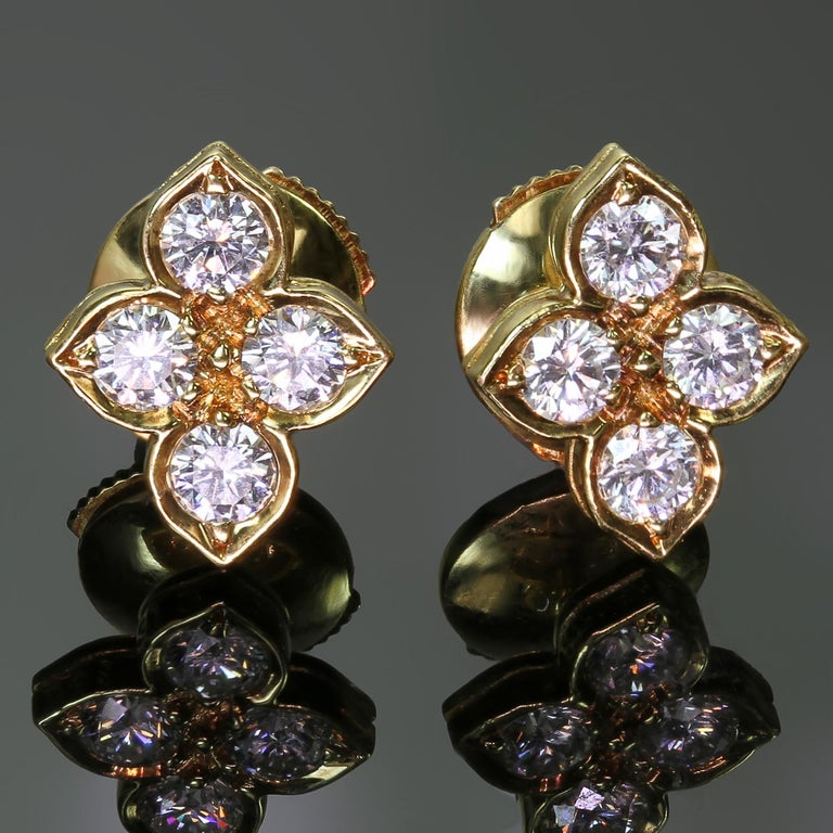 These gorgeous Cartier stud earrings from the elegant Hindu collection are crafted in 18k yellow gold and feature a 4-petal flower made up of brilliant-cut round D-E-F VVS1-VVS2 diamonds weighing an estimated 0.75-0.80 carats. Made in France circa