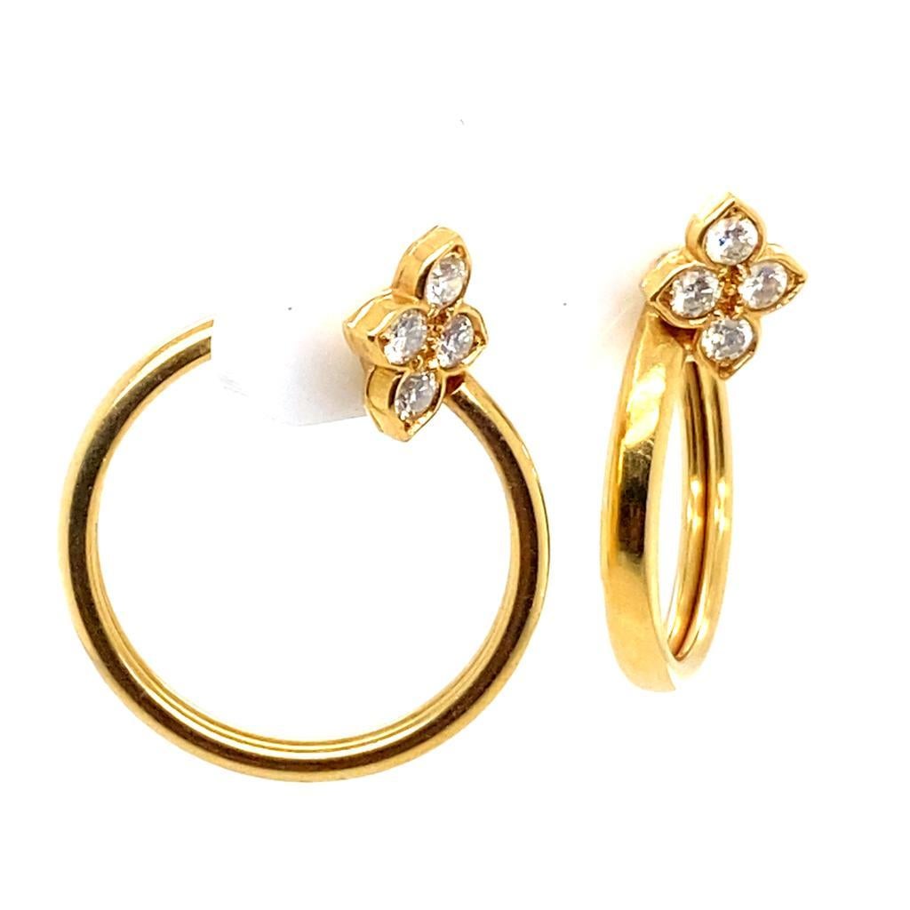 A pair of Cartier diamond hoop 18 karat yellow gold earrings from their Hindu Collection.

The Hindu Collection harks back to a long standing Cartier tradition of drawing inspiration from the East.

These plain polished gold hoop earrings feature a