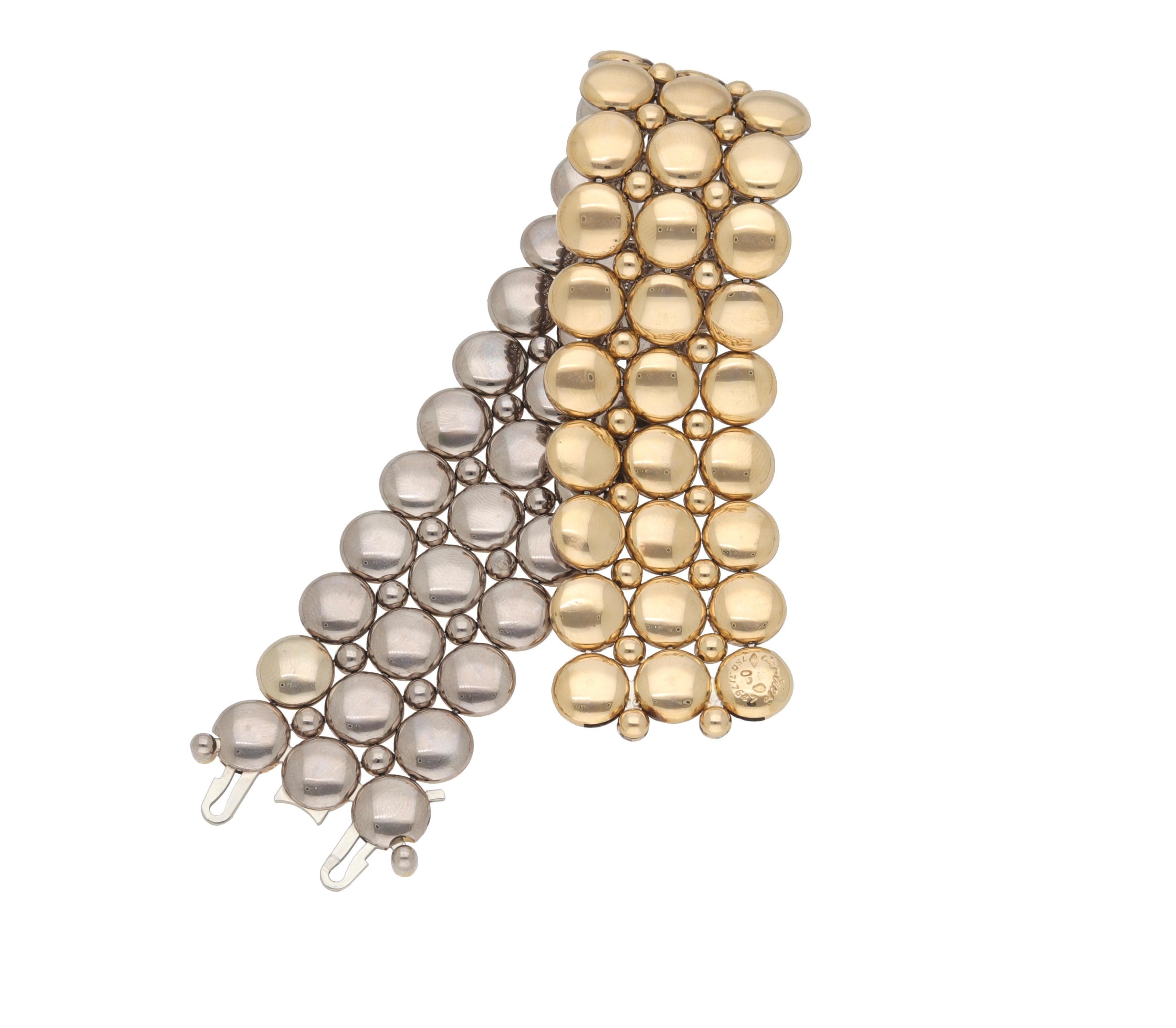 Reversible bracelet made of 18 kt. yellow and white gold signed Cartier.
This piece is part of Cartier's Honeymoon Collection. 
The bracelet can be worn in both white gold and yellow gold versions.
A classic piece of jewelry suitable for all
