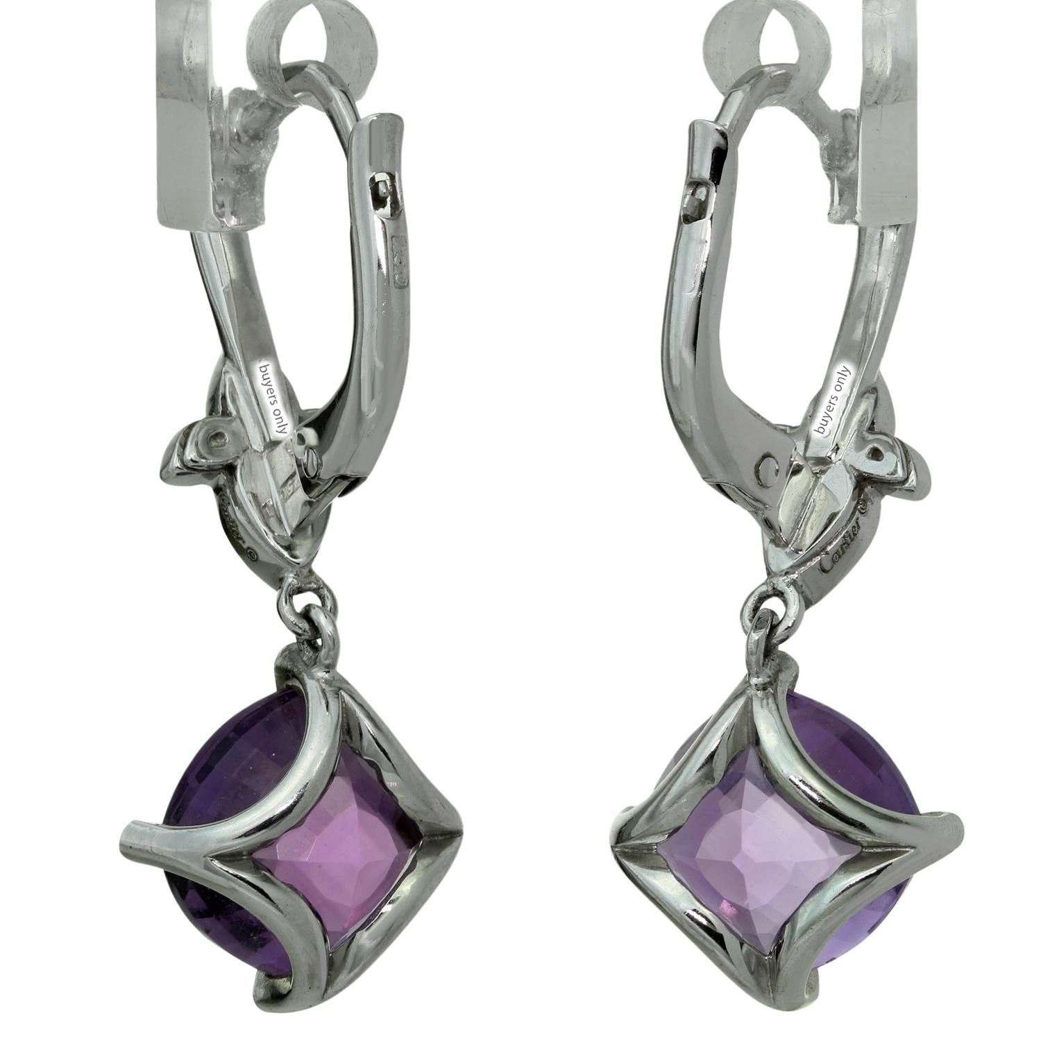 These fabulous dangling earrings from Cartier's elegant Inde Mysterieuse collection are crafted in 18k white gold, set with faceted amethyst gemstones and accented with brilliant-cut round D-F VVS1-VVS2 diamonds. Made in France circa 2010s.
