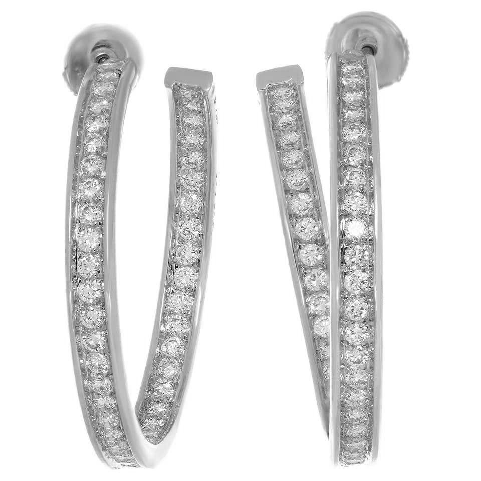 Cartier hoop earrings feature the unique inside out design, 18kt white gold set with brilliant-cut diamonds, average quality D to F - VVS.
Estimated total weight of diamonds : 3 carats.
French Hallmarks, circa 2000's, signed and