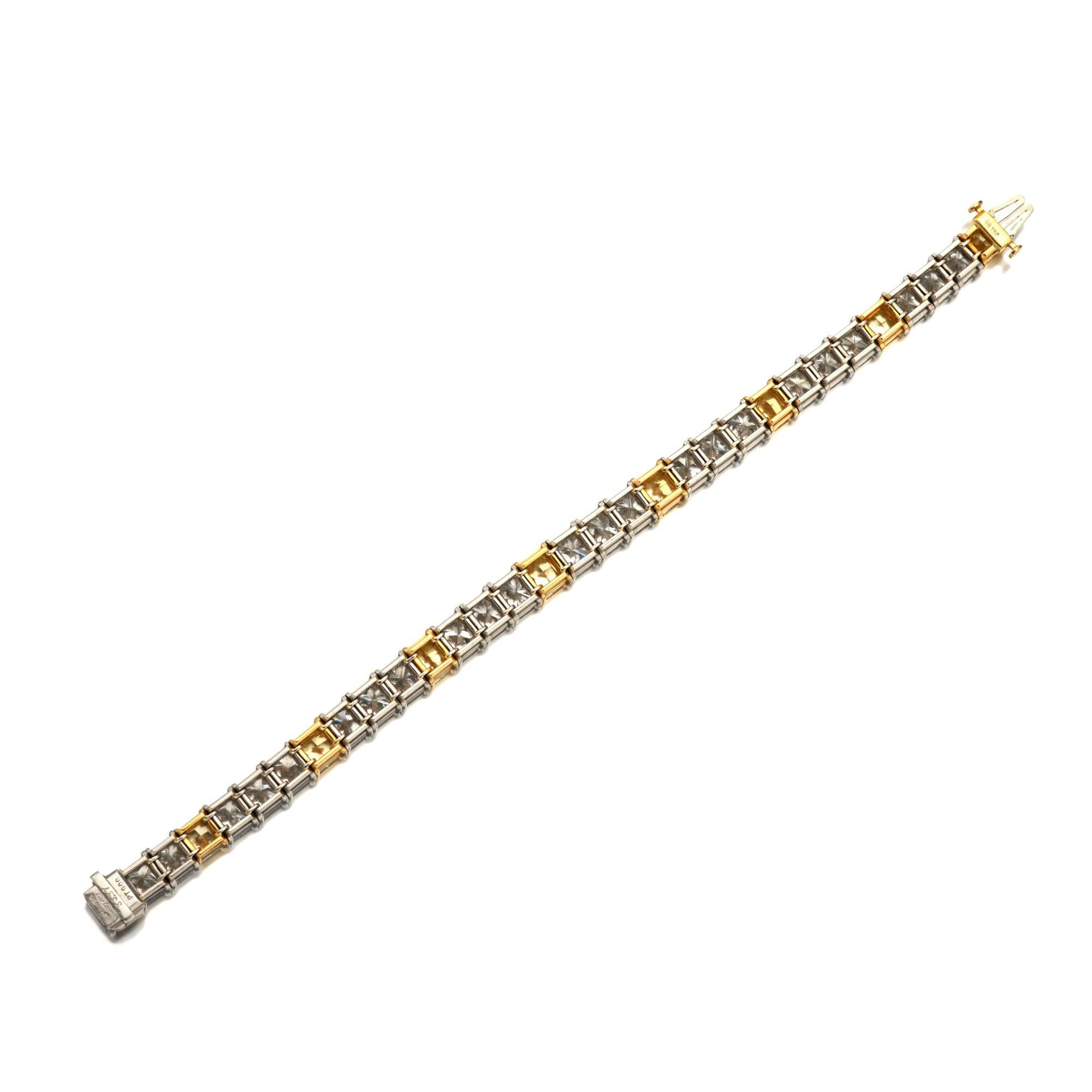 Cartier Colored Diamond   Bracelet. This line bracelet is designed as a line of
cut cornered modified brilliant-cut white diamonds weighing a total of approximately
24.70 carats  and yellow diamonds weighing a total of approximately 8.67