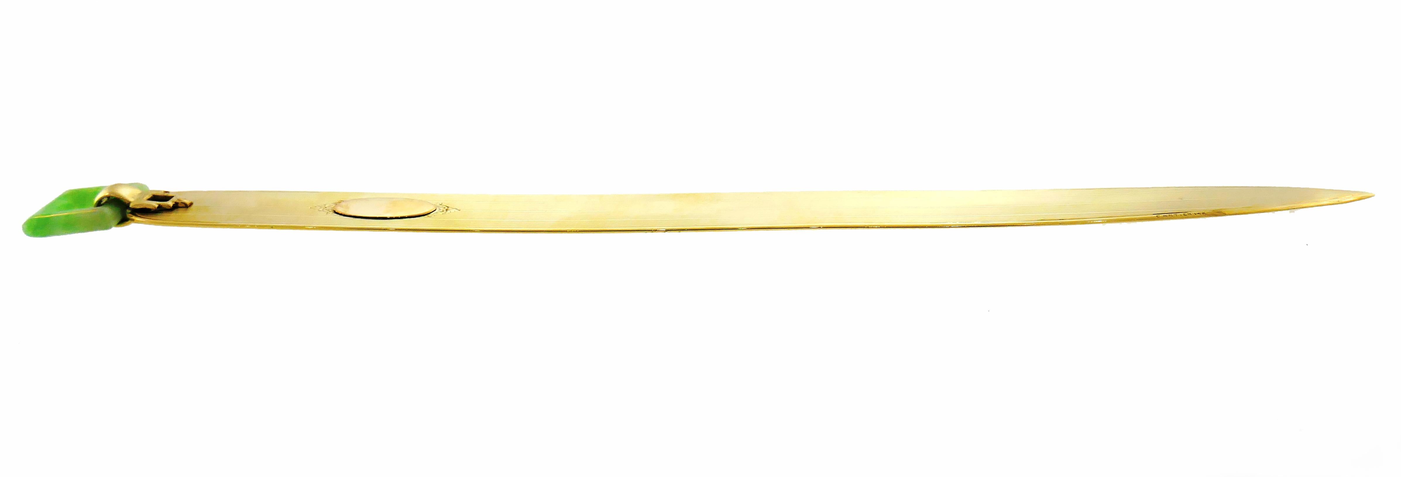 Slick and elegant letter opener created by Cartier, New York. Exquisite and chic, it makes a stylish gift and is a great addition to your accessories collection!
The letter opener is made of 14 karat yellow gold and jade. 
It is measures 7-1/4 x 1/2