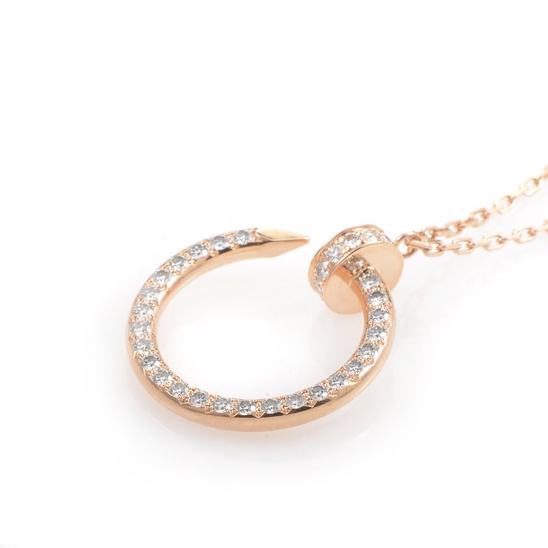 This dazzling pendant necklace from Cartier's Juste un Clou collection is edgy, yet feminine, and elegant. The necklace is made of 18K rose gold and boasts a nail-shaped pendant set with 0.38 ct of diamonds.