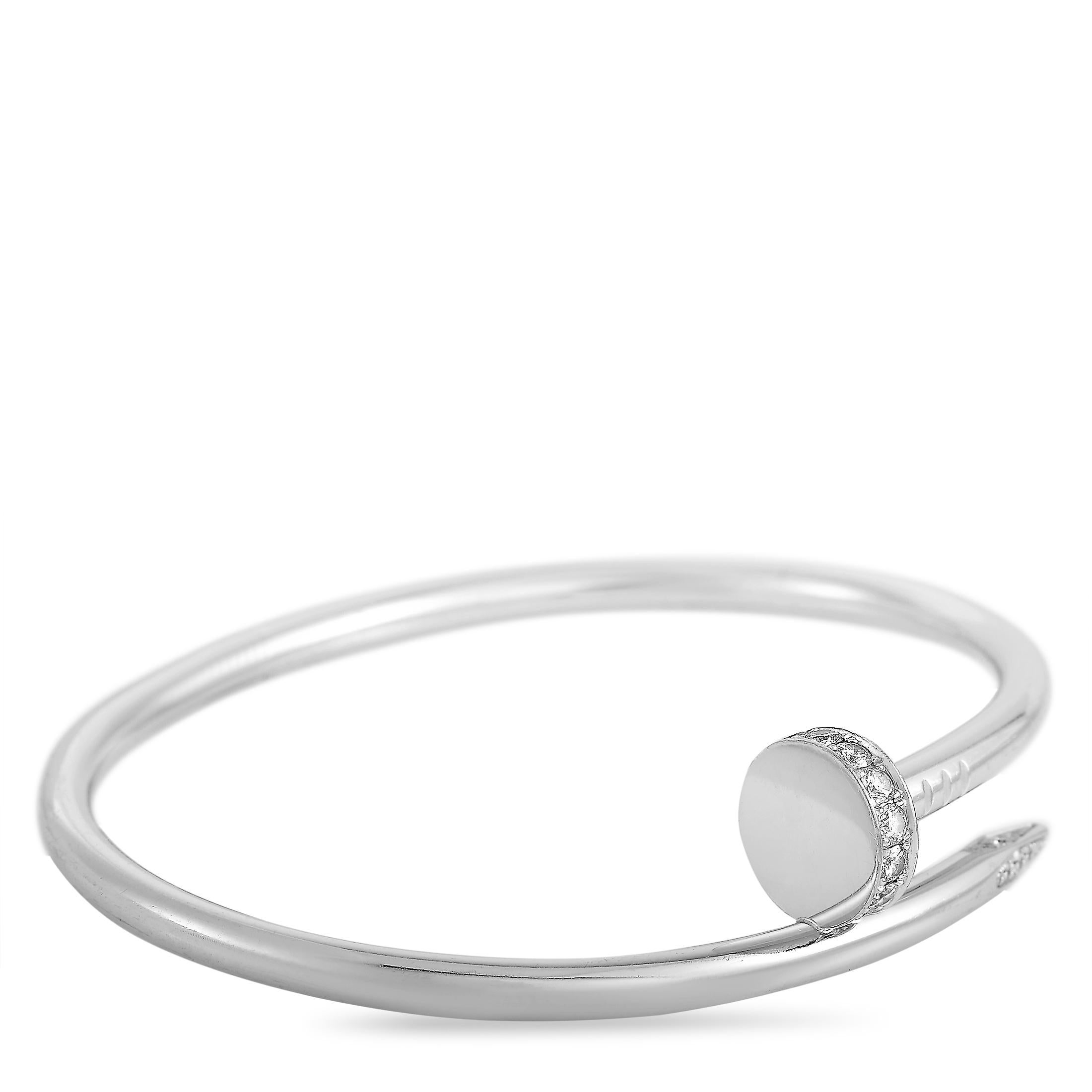 The Cartier “Juste un Clou” bracelet is made of 18K white gold and embellished with diamonds. The bracelet weighs 33.4 grams and measures 7.85” in length, boasting a 2.50” diameter.