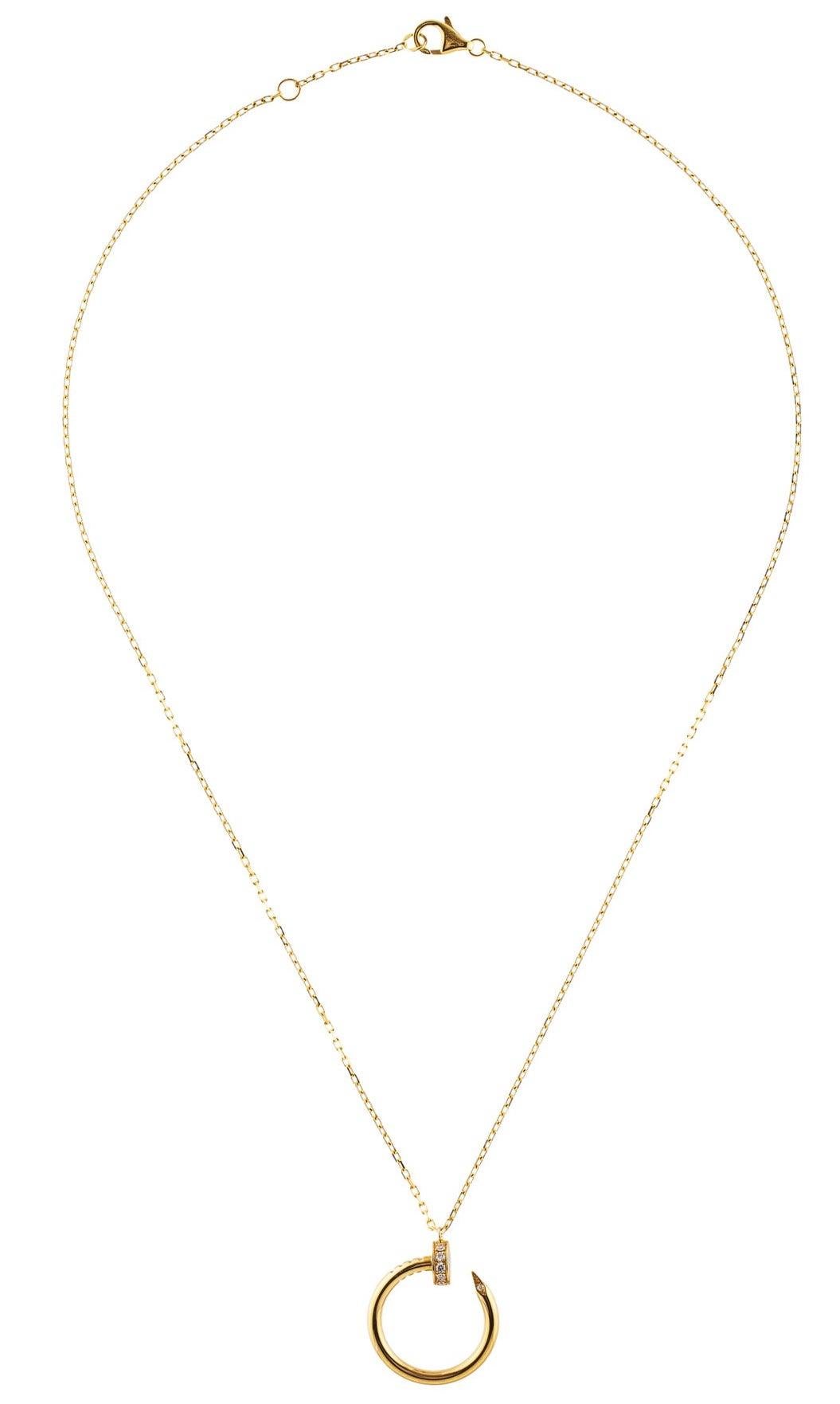 An authentic Cartier Juste un Clou necklace made in 18K yellow gold, set with 14 brilliant-cut diamonds totaling 0.12 carats. This necklace is 16 inches long. The nail pendant is .75 inches in diameter. The clasp is hallmarked Cartier AU750. Bid