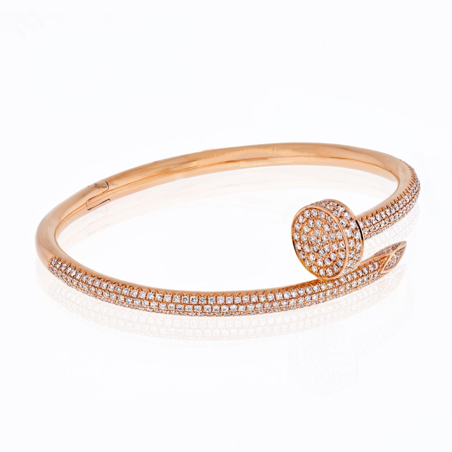 Crafted in 18K rose gold; set with round brilliant-cut diamonds, weighing a total of 2.26 carats (known weight), most with F-G color and VVS-VS clarity; inner circumference measures 6 inches, Cartier size 15 cm, 5/8 inch at widest section; weight