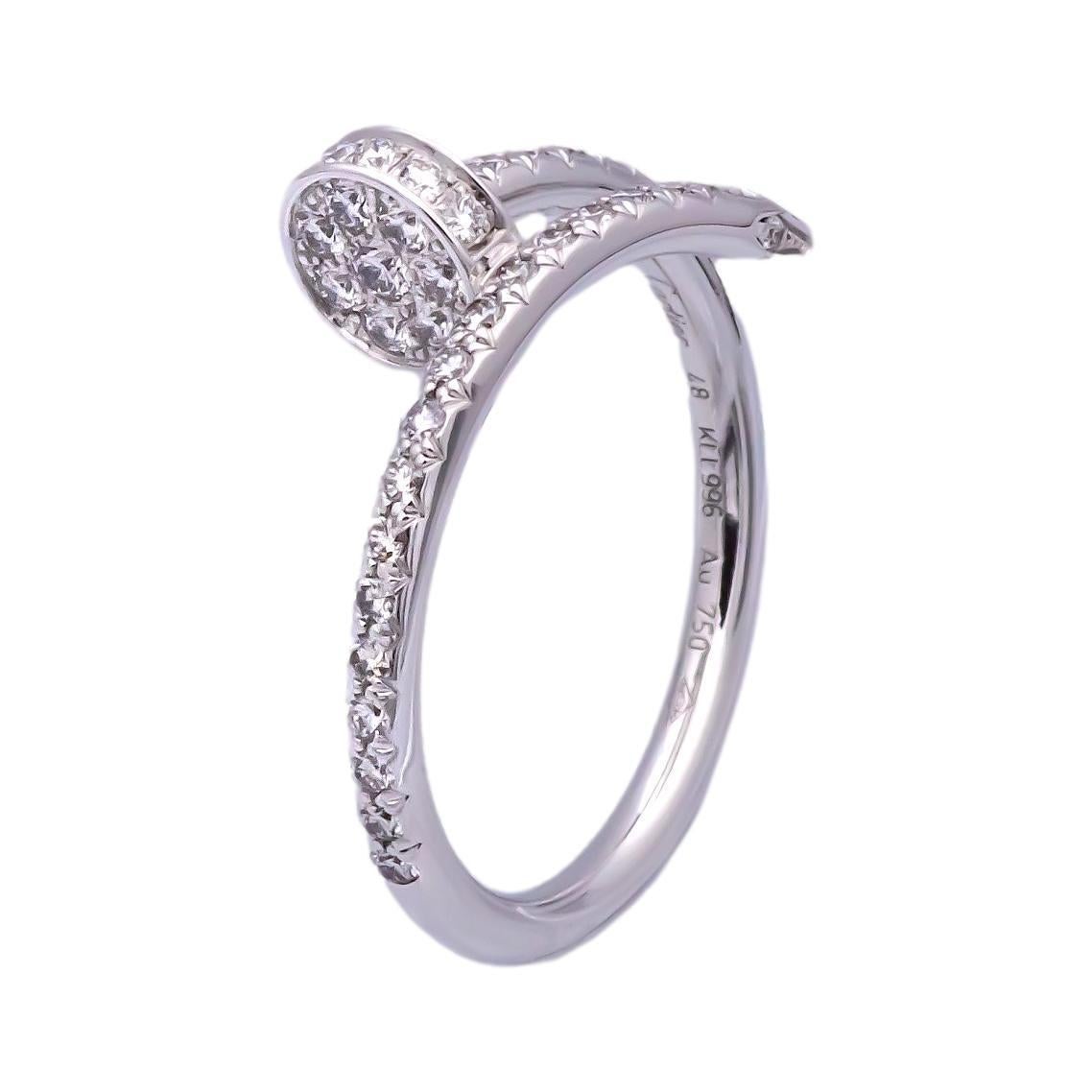 Cartier ring from the Juste un Clou collection finely crafted in 18 karat white gold encrusted with 53 pave set round brilliant cut diamonds weighing a total of 0.40 carats total weight in a wrap around nail design. The ring fits finger size 48 (