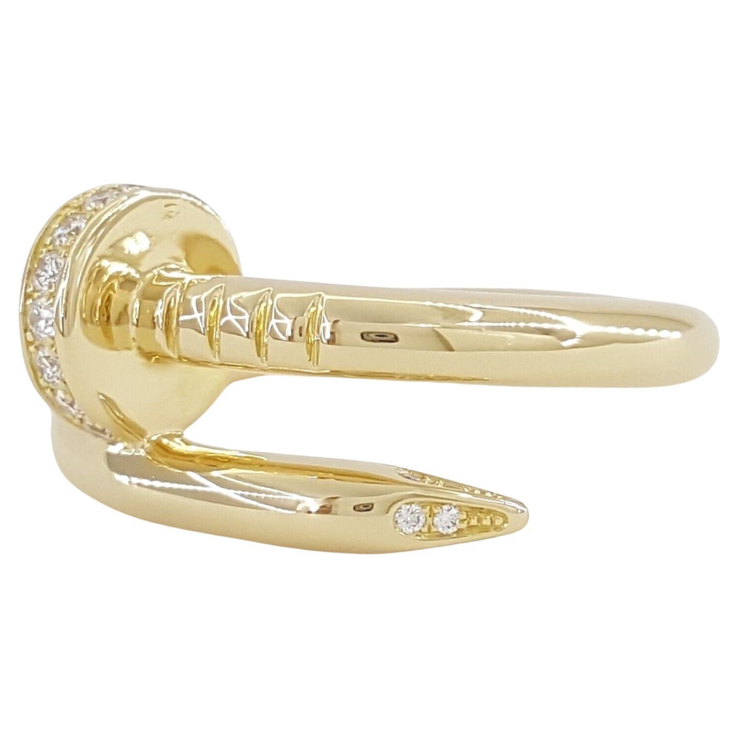 This Cartier Juste un Clou ring is a remarkable example of luxury and iconic design, crafted in sumptuous 18K yellow gold. The ring, weighing 7.5 grams, boasts a solid and substantial feel, indicative of its high quality and Cartier's attention to