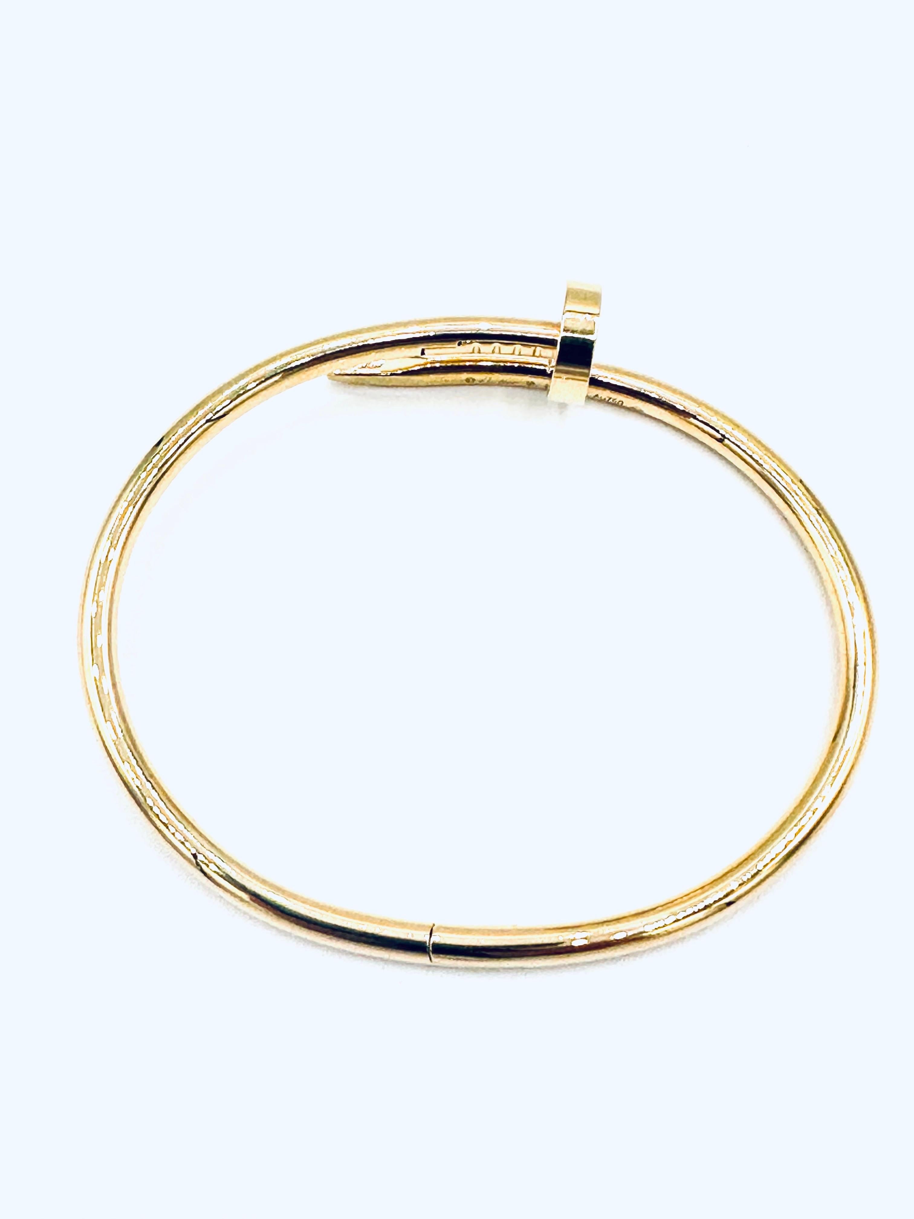 The iconic Cartier Juste un Clou nail bracelet in 18K yellow gold.  A reemergence of the original design by famed master craftsman Aldo Cipullo.  Conceived in '70s New York, the Juste un Clou collection reflects the bold spirit of the era. Its
