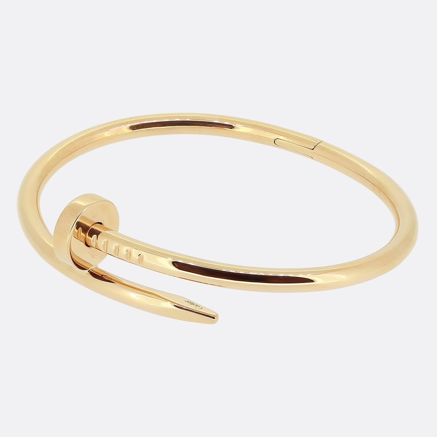 Here we have an 18ct rose gold bracelet from the luxury jewellery house of Cartier. The particular piece forms part of the world renowned Juste un Clou collection and showcases a wrap around nail design. This is the larger model with a hinged