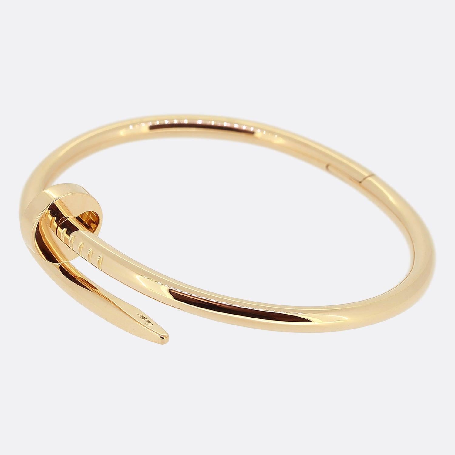 Here we have an 18ct rose gold bracelet from the luxury jewellery house of Cartier. The particular piece forms part of the world renowned Juste un Clou collection and showcases a wrap around nail design. This is the larger model with a hinged
