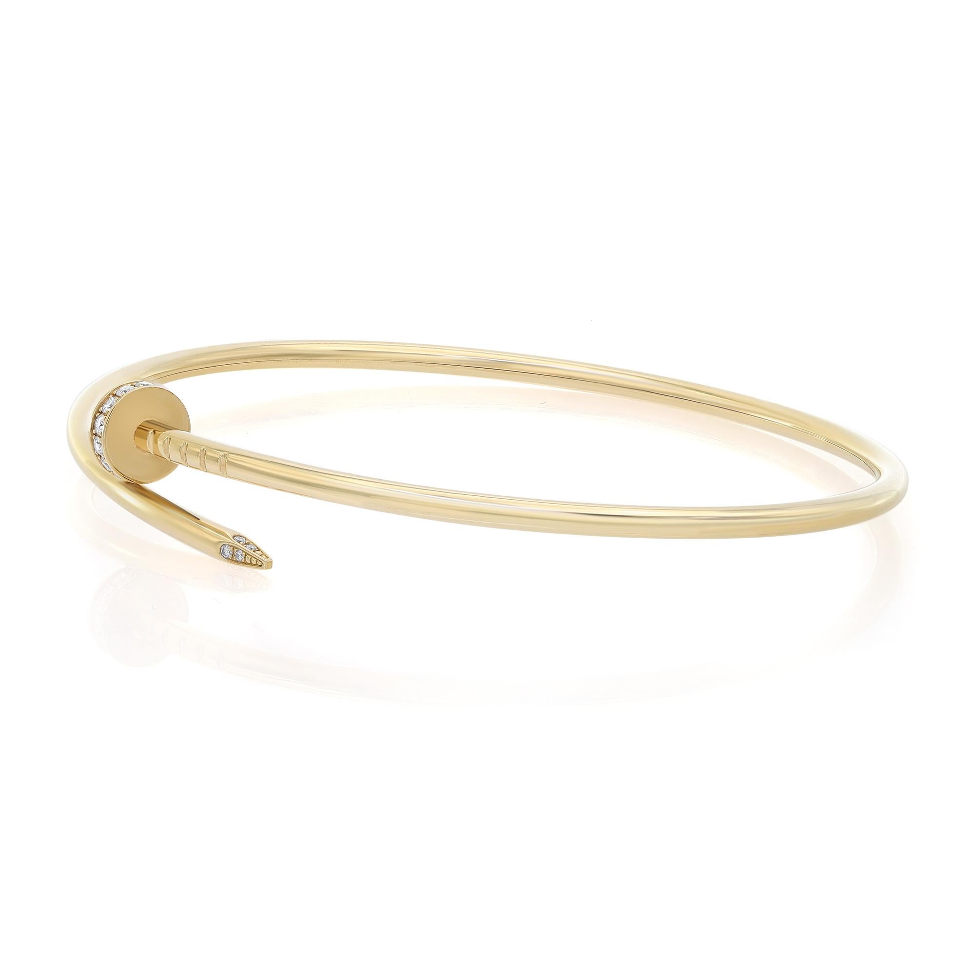 Cartier Juste un Clou bracelet, small model, crafted in 18K yellow gold. Set with 20 round brilliant-cut diamonds totaling 0.18 carat. Size 19. Width 2.5 mm. Unworn condition. Comes with an original box and paper.
