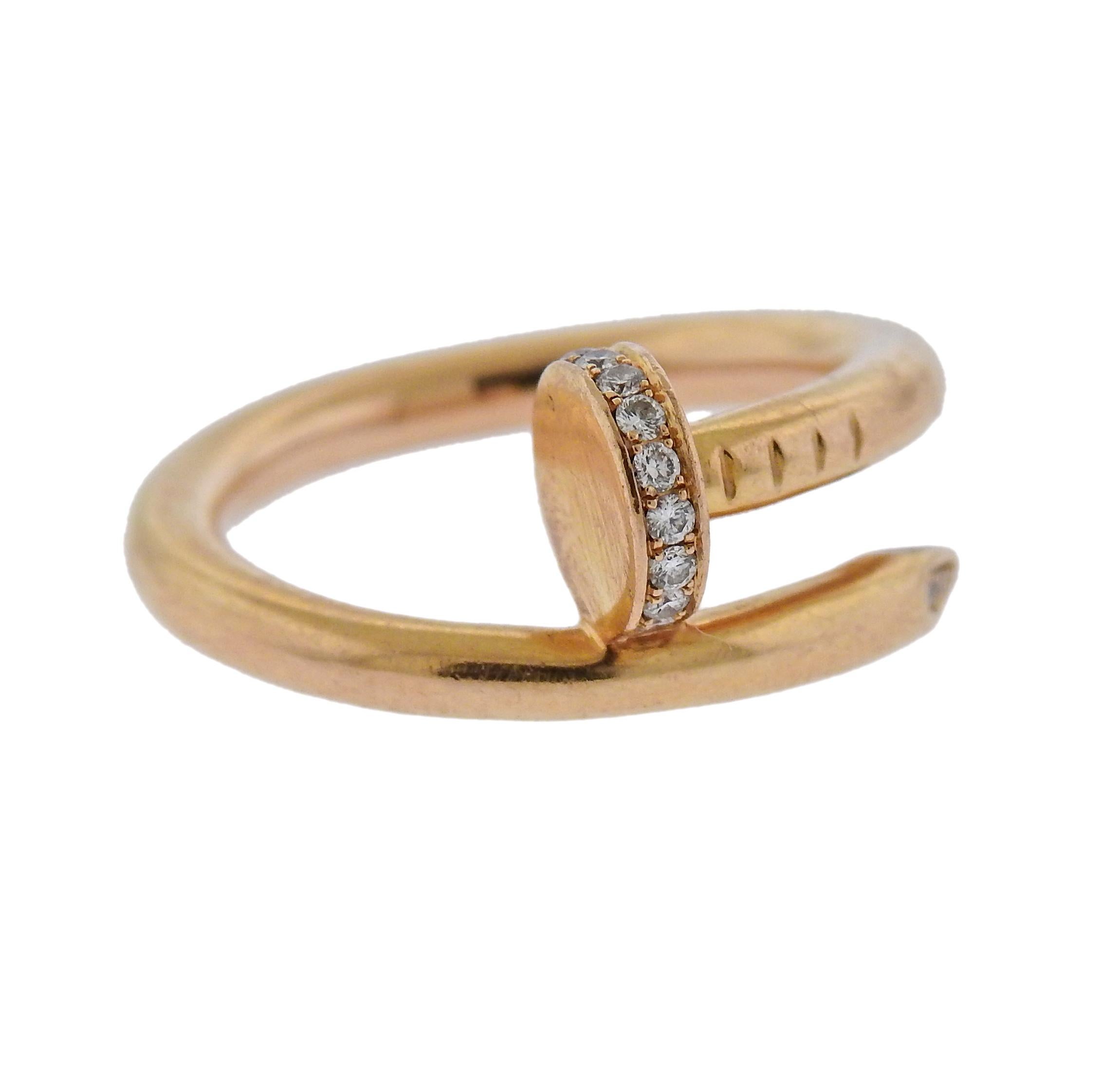 18k rose gold nail ring from current Juste Un Clou collection, adorned with 0.13ctw in G/VS diamonds. Retail $3800. Ring size - 6, width of the top is 10mm and weighs 7.4 grams. Marked Cartier, 750, 52, SJ8133.