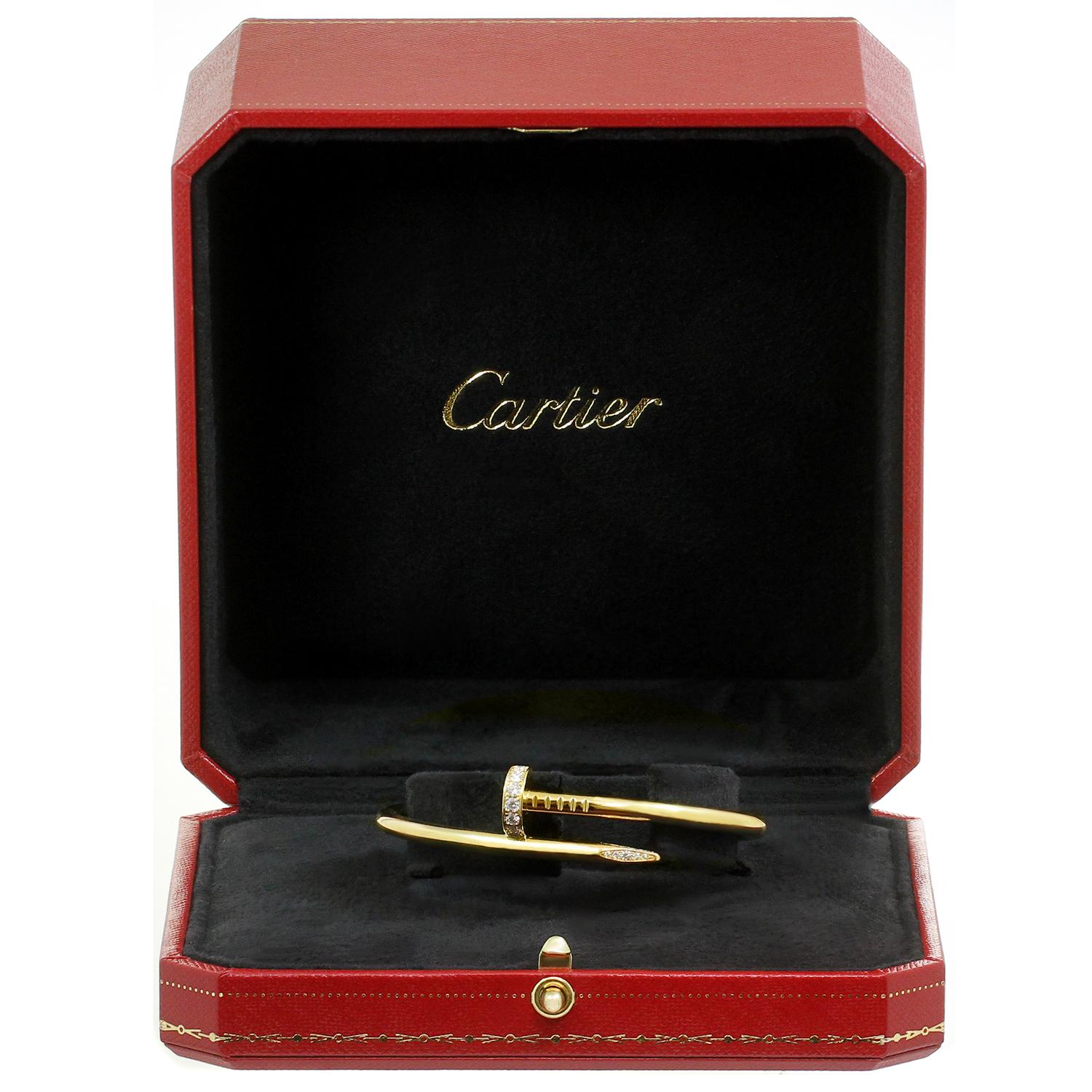 This elegant hinged bracelet from Cartier's iconic Juste Un Clou collection is crafted in 18k yellow gold and set with brilliant-cut round D-F VVS1-VVS2 diamonds of an estiamted 0.59 carats. This is the new model of the bangle in size 16. Made in