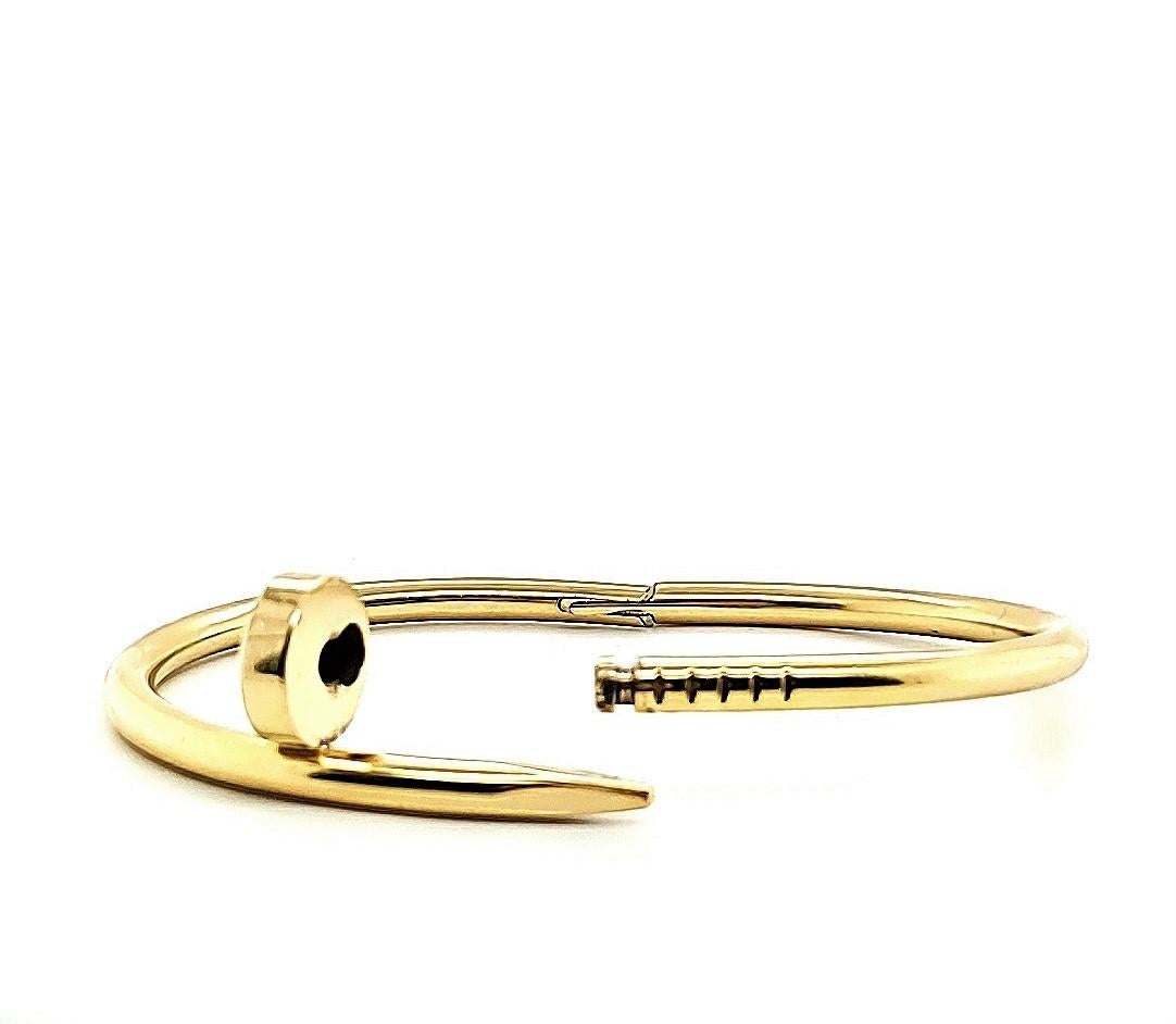 Designed as a 'just a nail', this authentic Cartier 'Juste un Clou' bracelet is modern, transcending the every day, yet bold. The nail bracelet is an innovative twist on a familiar and ordinary object. Signed Cartier, 15, Au750. Bracelet is 3.5mm in