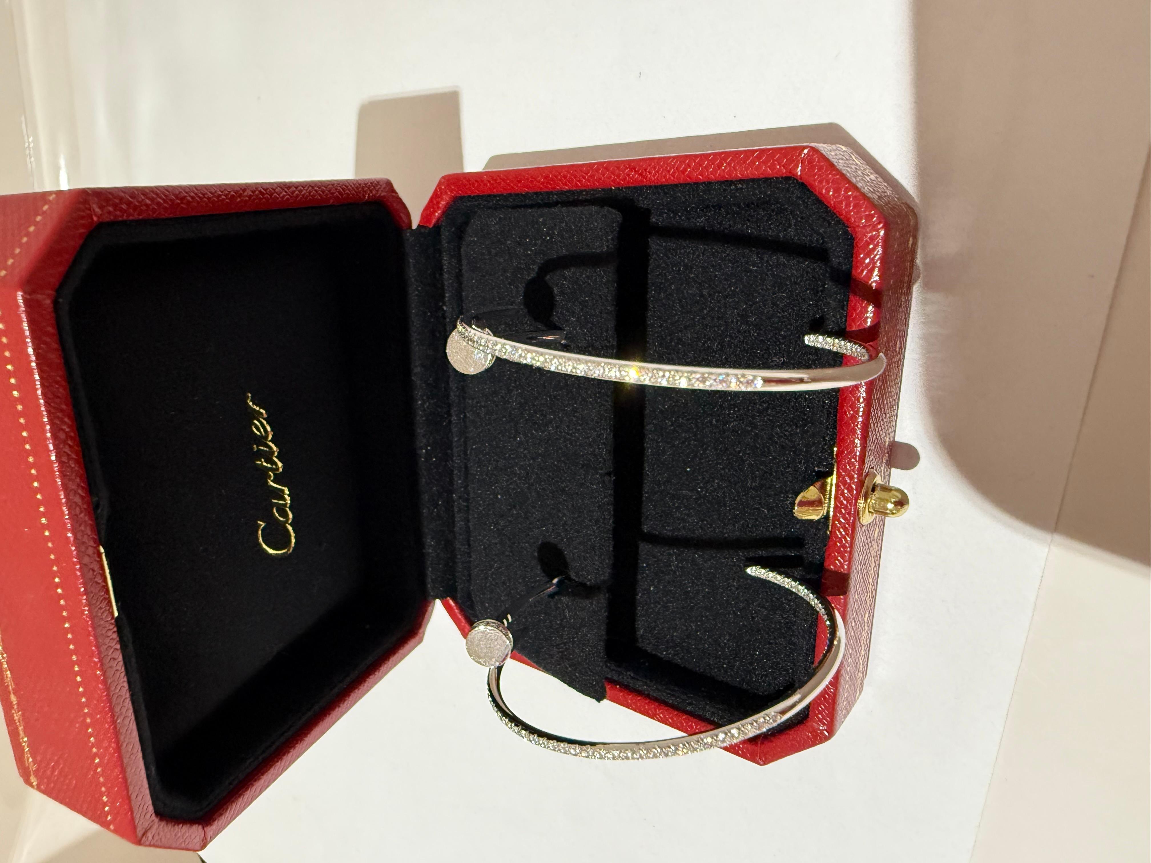 Cartier Juste un clou Hoop earrings in white gold paved diamonds. Juste un Clou earrings, white gold 750/1000, each set with 176 brilliant-cut diamonds totalling 1.26 carats. Width: 1.8 mm. 
Come in Cartier box.