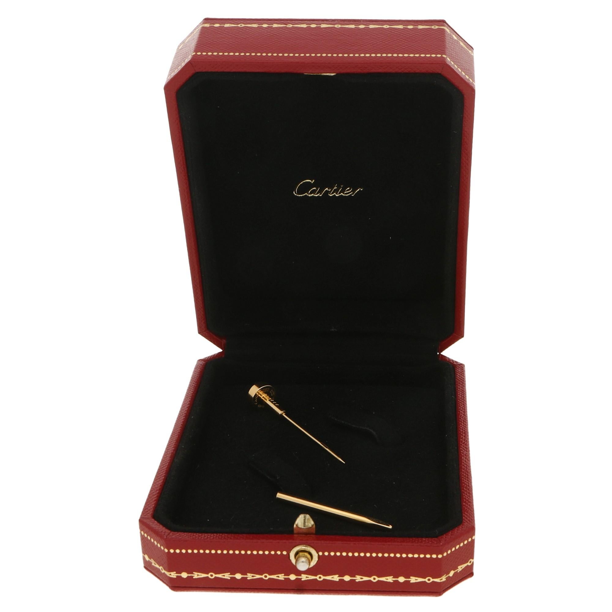 A vintage signed Cartier 18ct yellow gold stick pin in the shape of the classic Juste Un Clou nail design. 
The piece comes with its original box and a sturdy stopped to keep the stick pin in place when wearing! 

Gross weight 5.44 grams.
