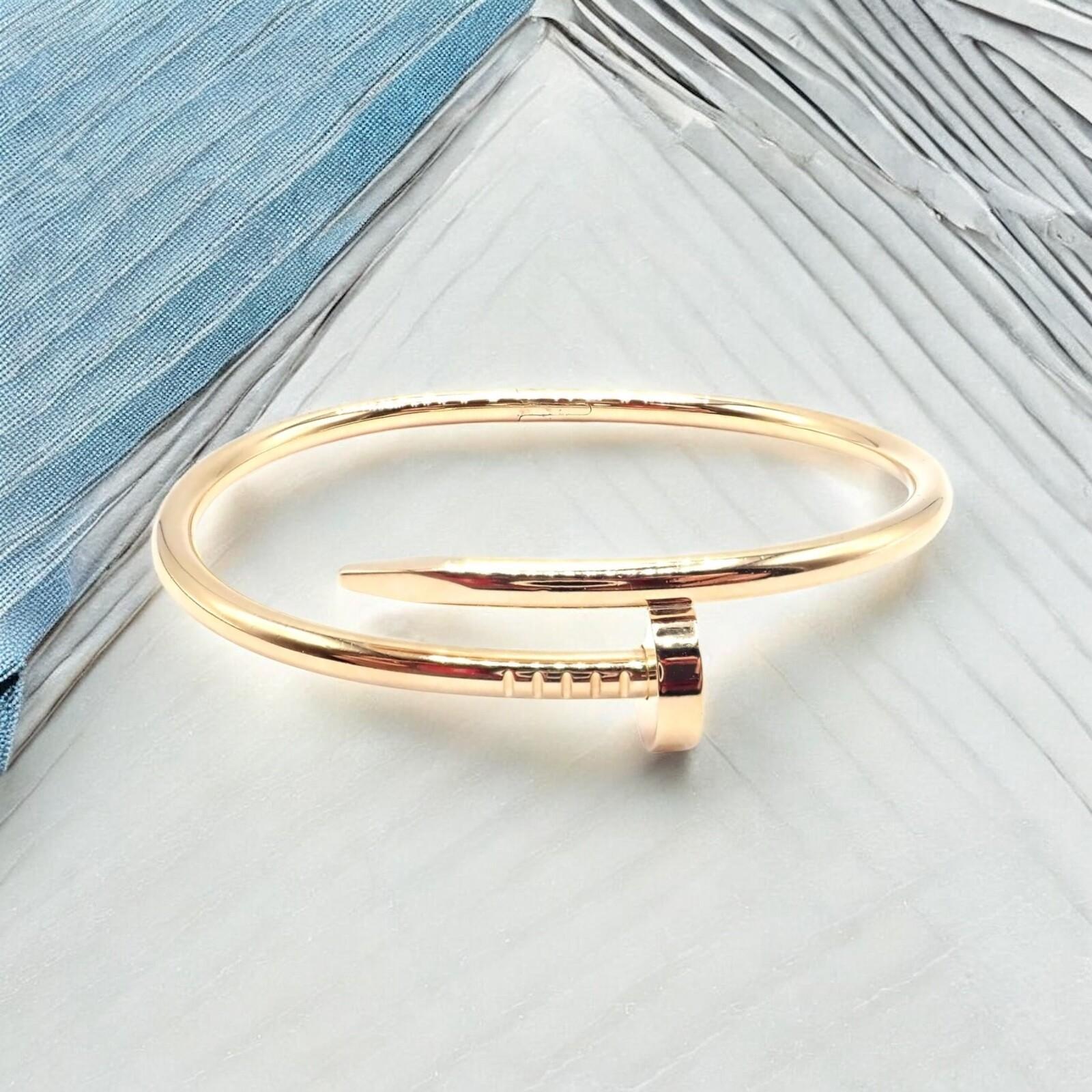 18k Yellow Gold Juste Un Clou Nail Bangle Bracelet Size 17 by CARTIER. 
Cartier’s iconic Juste un Clou bangle in 18k yellow gold reimagines the humble nail as an audacious statement piece. 
Crafted in Size 17, it epitomizes edgy sophistication while