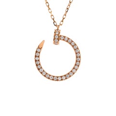 Cartier, collier pendentif Juste un Clou en or rose 18 carats et diamants pavés