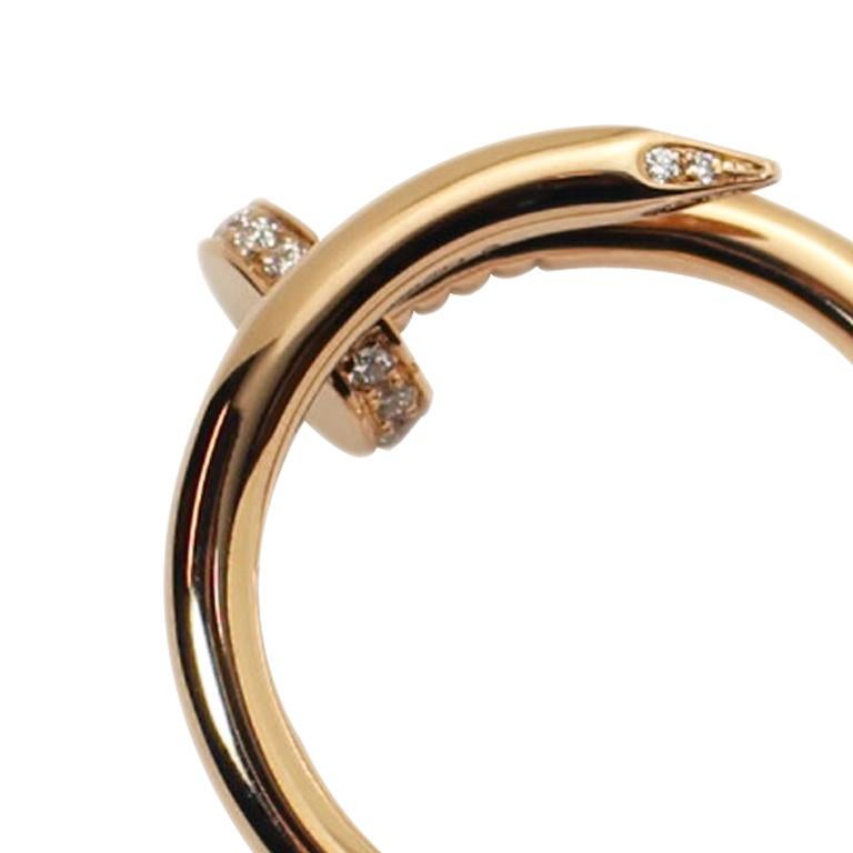 Circa 2016 Cartier Juste Un Clou Nail Ring, 18K Pink Gold with Diamonds set into the perimeter of the head and the tip of the nail. Finger size 8 1/2  ( 56 European )  Comes. in the original Cartier suede Travel pouch