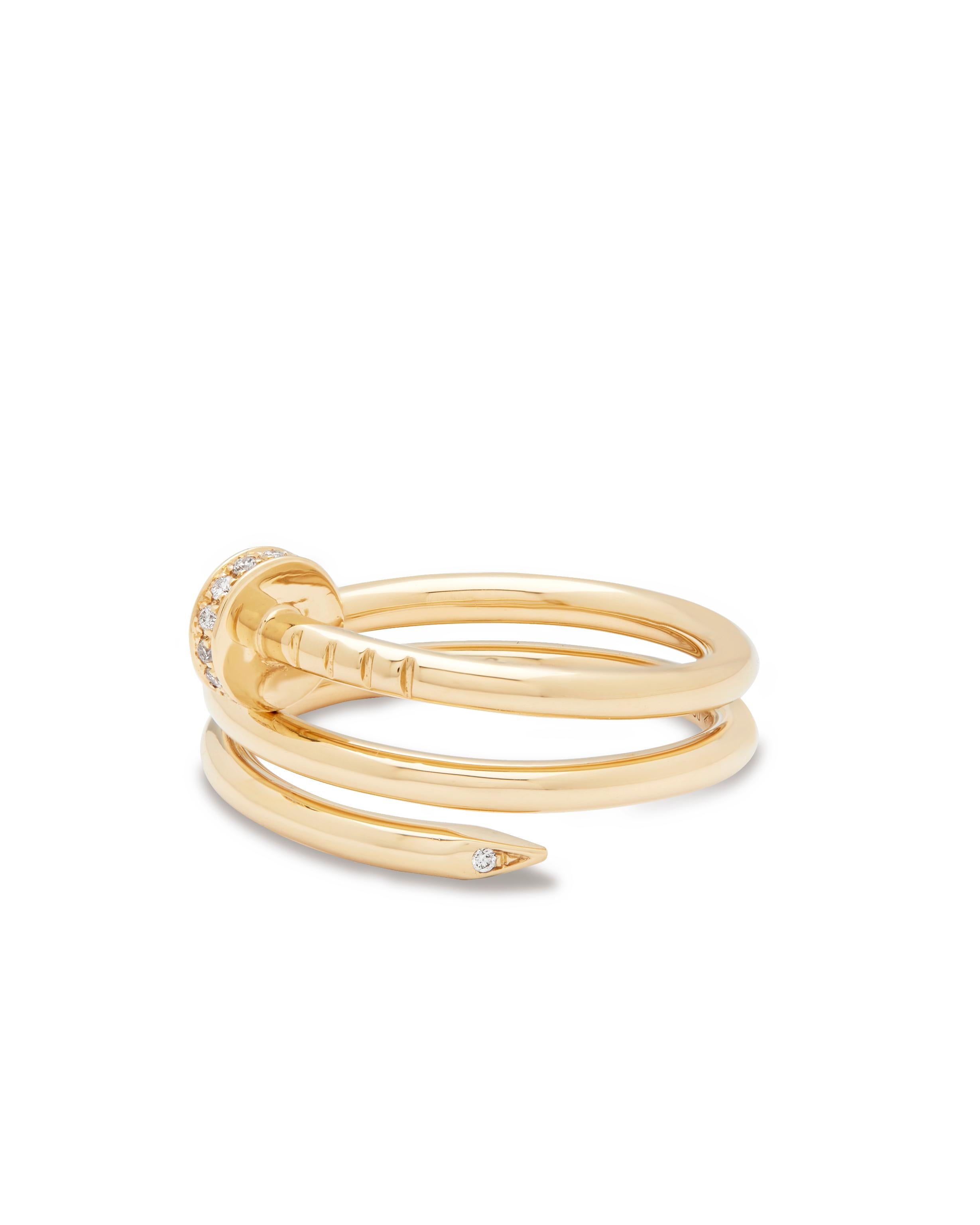 Cartier Juste Un Clou diamond ring model number B4211854

One of Cartier iconic pieces, Juste Un Clou transforms the simple nail into a contemporary piece of jewellery. 
Set in 18ct yellow gold, set with 14 Diamonds at approx 0.08ct 
Each band