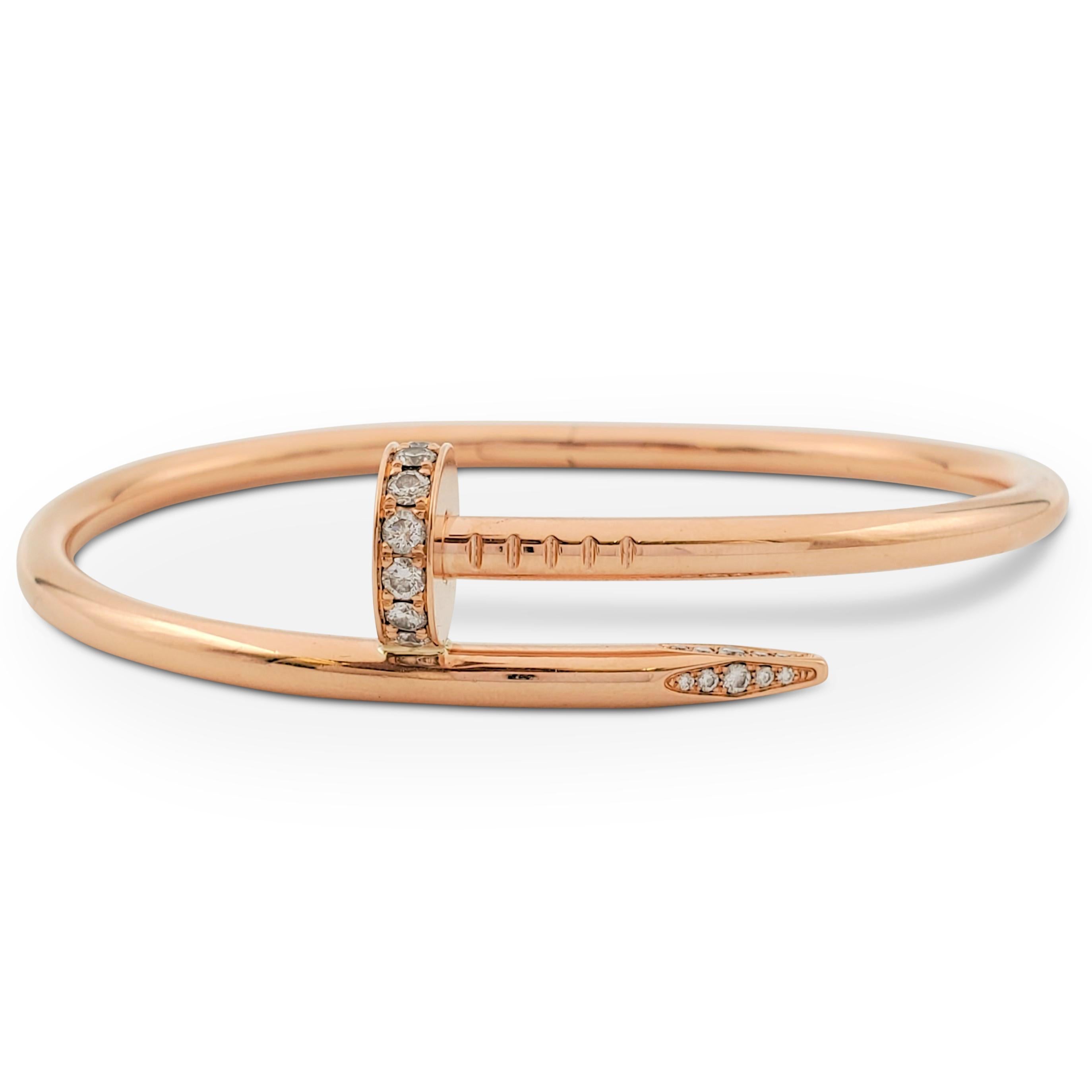 Designed as a 'just a nail', this authentic Cartier 'Juste un Clou' bracelet is an innovative twist on a familiar and ordinary object. The bracelet is set with high-quality round brilliant cut diamonds (E-F color, VS) weighing an estimated 0.59