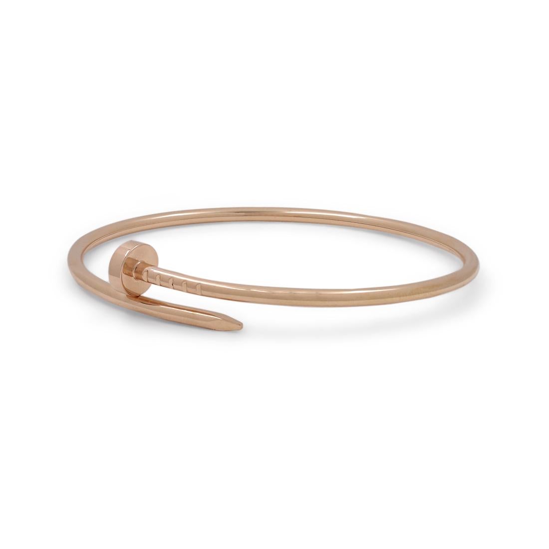Designed as a 'just a nail', this authentic Cartier 'Juste un Clou' bracelet is an innovative twist on a familiar and ordinary object. Signed Cartier, 17, Au750, with serial number and hallmark. Size 17. The bracelet is presented with the original