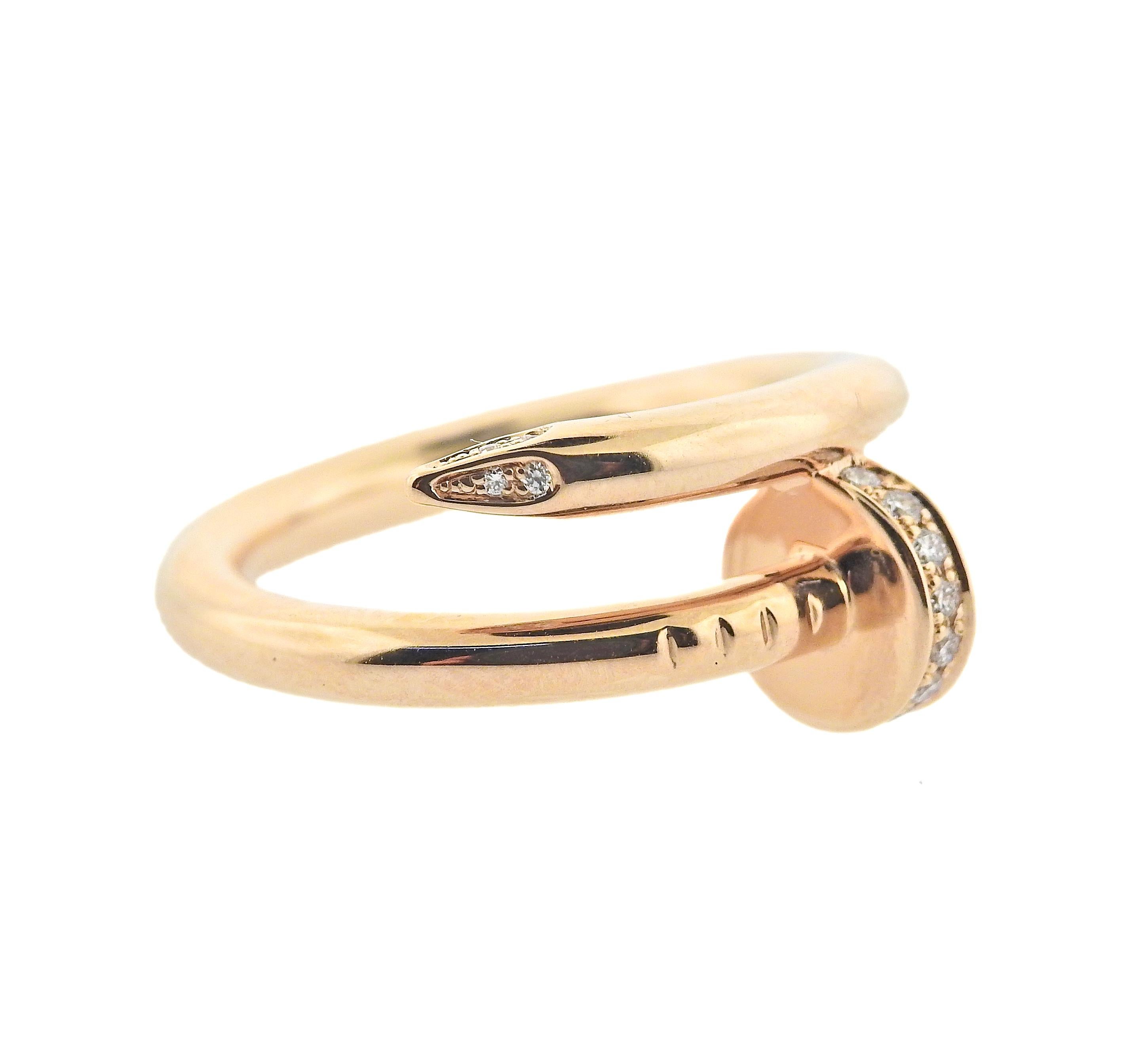 Iconic 18k Rose gold Juste Un Clou nail ring by Cartier, with 0.13ctw G/VS diamonds. Ring comes with COA and box. Retail $4200. Ring size 5.5, ring is 10mm wide. Marked VS15**, Cartier, 750, 51. Weight 7.3 grams.